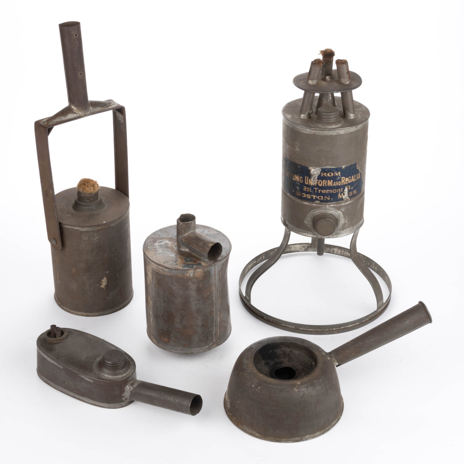 ASSORTED SHEET-IRON TORCH LAMPS, LOT OF FIVE: ASSORTED SHEET-IRON TORCH LAMPS, LOT OF FIVE, comprising four examples with a sheet-iron shaft for wooden handle attachment, forms include two cylinder, a circular form with deep well and an oblo