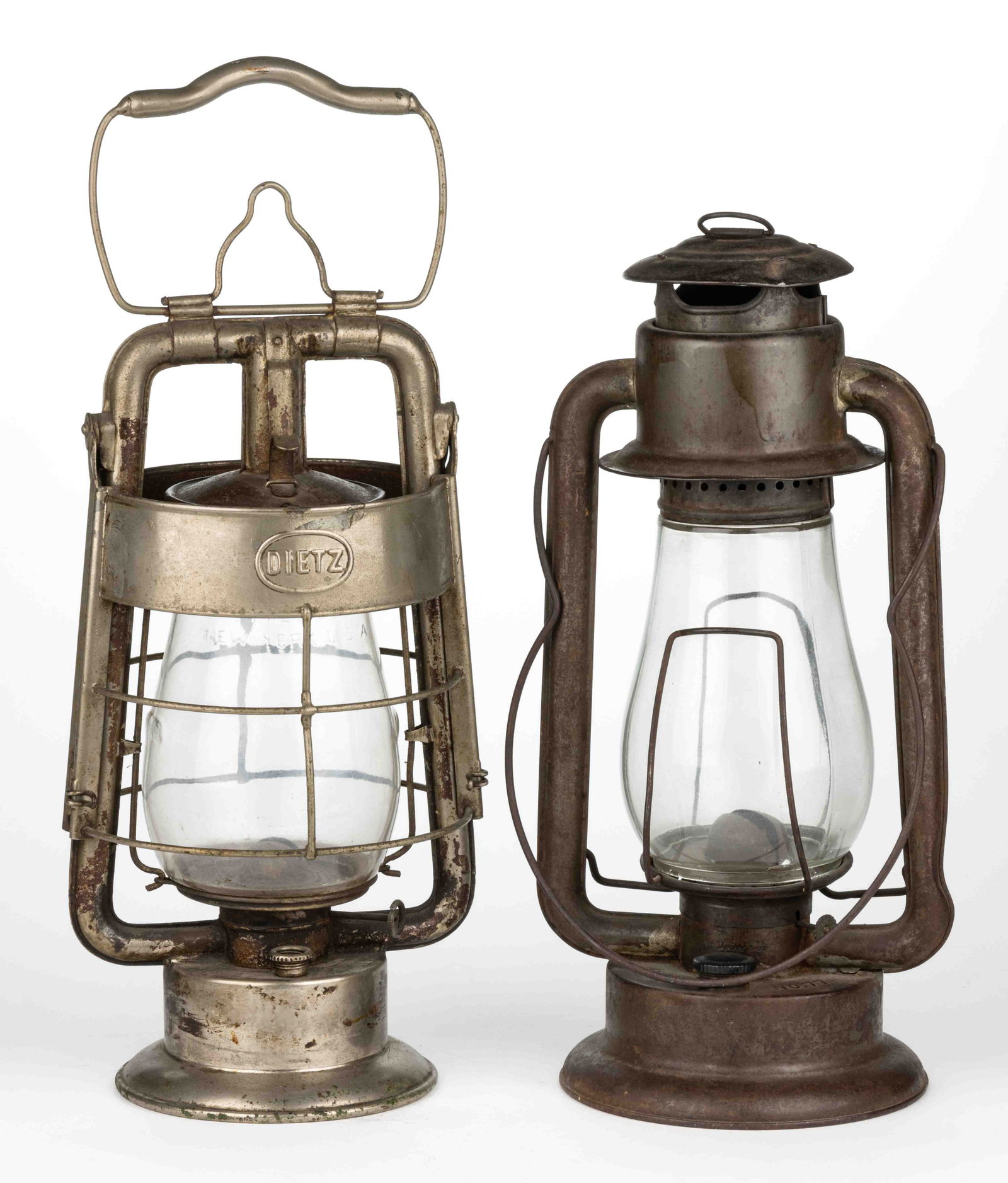 ASSORTED SHEET-IRON TUBULAR LANTERNS, LOT OF TWO: ASSORTED SHEET-IRON TUBULAR LANTERNS, LOT OF TWO, comprising a nickel-plated Dietz "King" fire department hot blast example, font embossed "DIETZ KING FIRE DEPT", wind shield embos