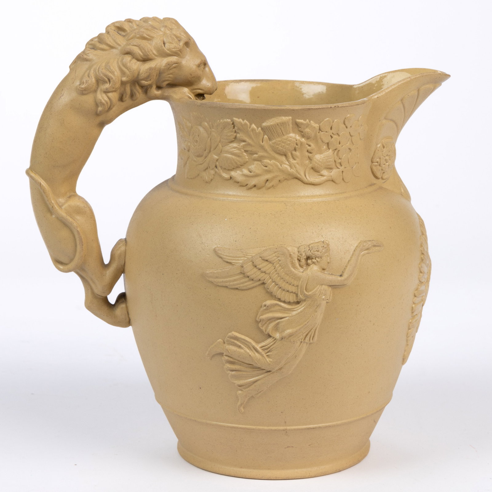 ENGLISH STAFFORDSHIRE SMEAR-GLAZED STONEWARE GEORGE IV COMMEMORATIVE JUG: ENGLISH STAFFORDSHIRE SMEAR-GLAZED STONEWARE GEORGE IV COMMEMORATIVE JUG, buff-colored with a molded lion handle, featuring relief decorations including a profile of the king with surrounding sunburst