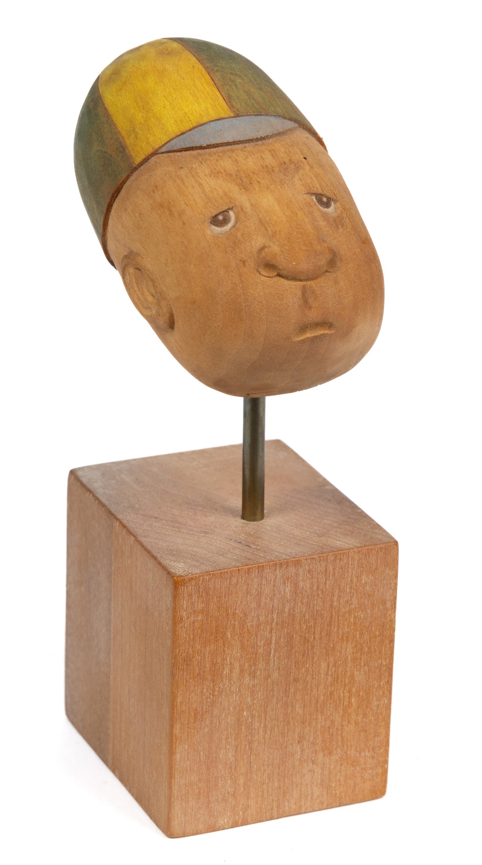 JOHN L. HEATWOLE (1948-2006), SHENANDOAH VALLEY OF VIRGINIA, FOLK ART CARVING: JOHN L. HEATWOLE (1948-2006), SHENANDOAH VALLEY OF VIRGINIA, FOLK ART CARVING, a depiction of a frowning boy wearing a striped cap. Signed and titled verso "SCHOOL DAYS / JL HEATWOLE VA