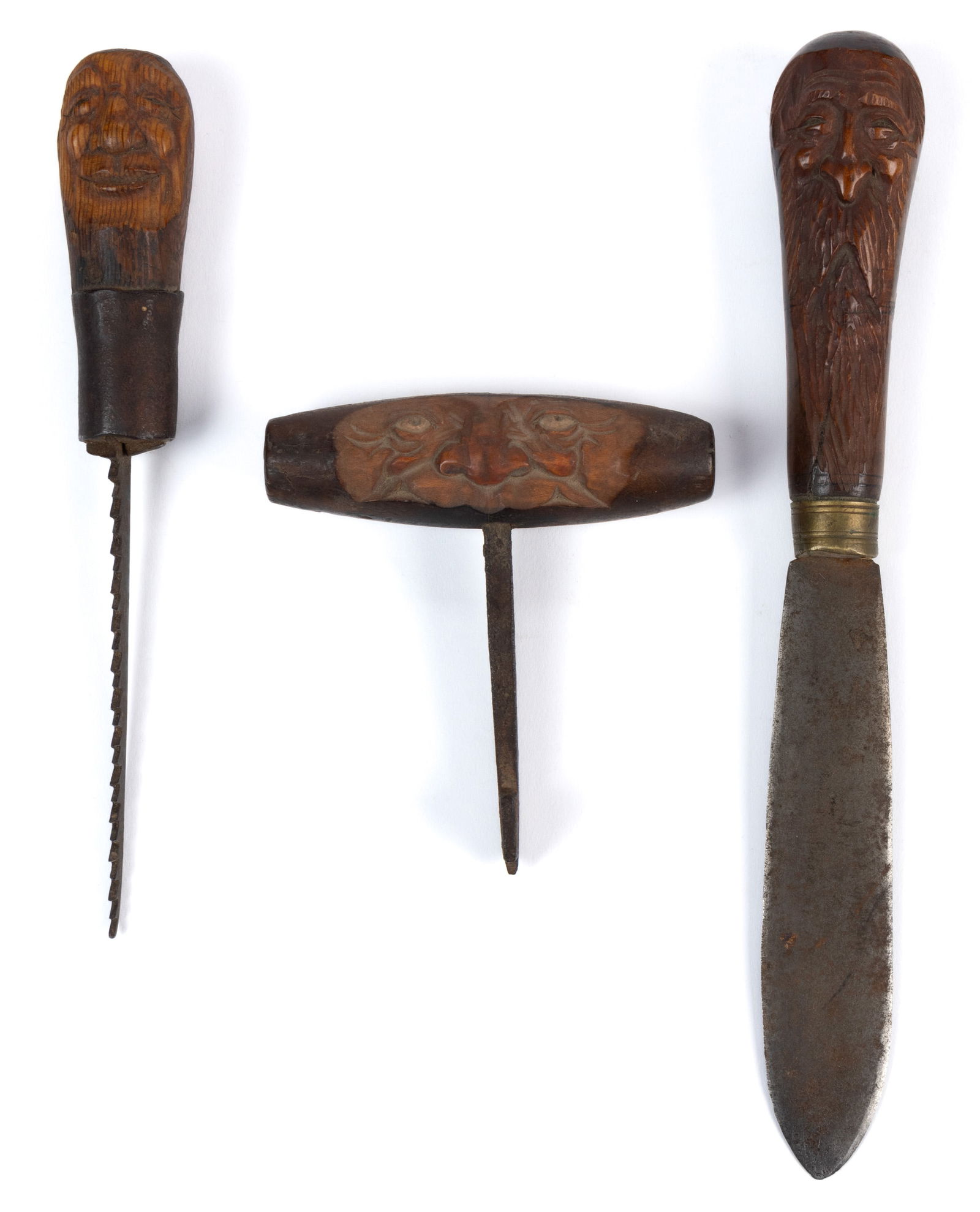 JOHN L. HEATWOLE (1948-2006), SHENANDOAH VALLEY OF VIRGINIA, FOLK ART CARVED TOOLS, LOT OF THREE: JOHN L. HEATWOLE (1948-2006), SHENANDOAH VALLEY OF VIRGINIA, FOLK ART CARVED TOOLS, LOT OF THREE, each handle carved with faces of men, one with a long beard. Two initialed "JLH", and o