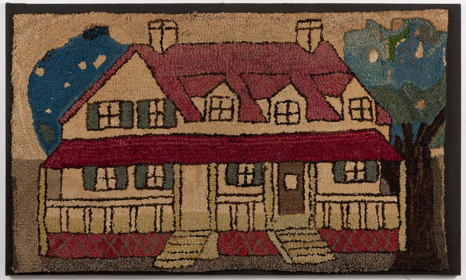 MID-ATLANTIC FOLK ART HOUSE PICTORIAL HOOKED RUG: MID-ATLANTIC FOLK ART HOUSE PICTORIAL HOOKED RUG, rectangular form, depicting a large two-story house with a porch and a red roof, featuring a tree next to it on the right. Mounted to fabric on a wood