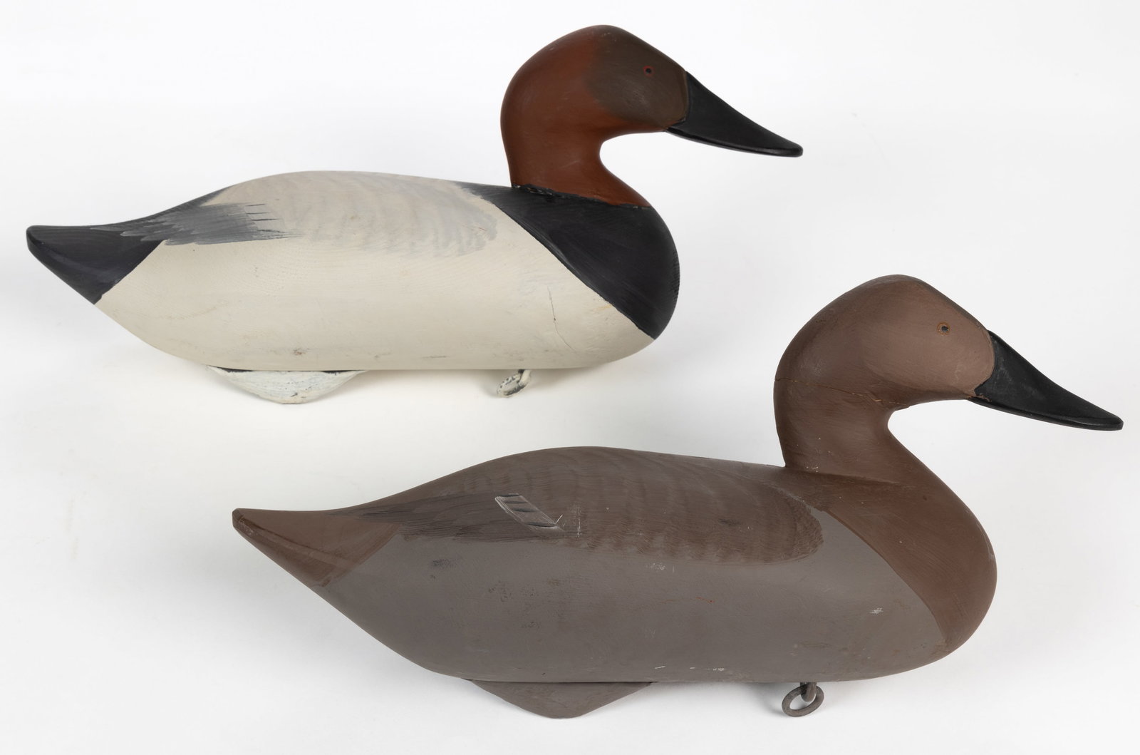 R. MADISON MITCHELL (MARYLAND, 1901-1993) ATTRIBUTED, CANVASBACK DUCK DECOYS, LOT OF TWO: R. MADISON MITCHELL (MARYLAND, 1901-1993) ATTRIBUTED, CANVASBACK DUCK DECOYS, LOT OF TWO, comprising what appear to be a male and female canvasback duck, each fully hand-painted with weights and hooks