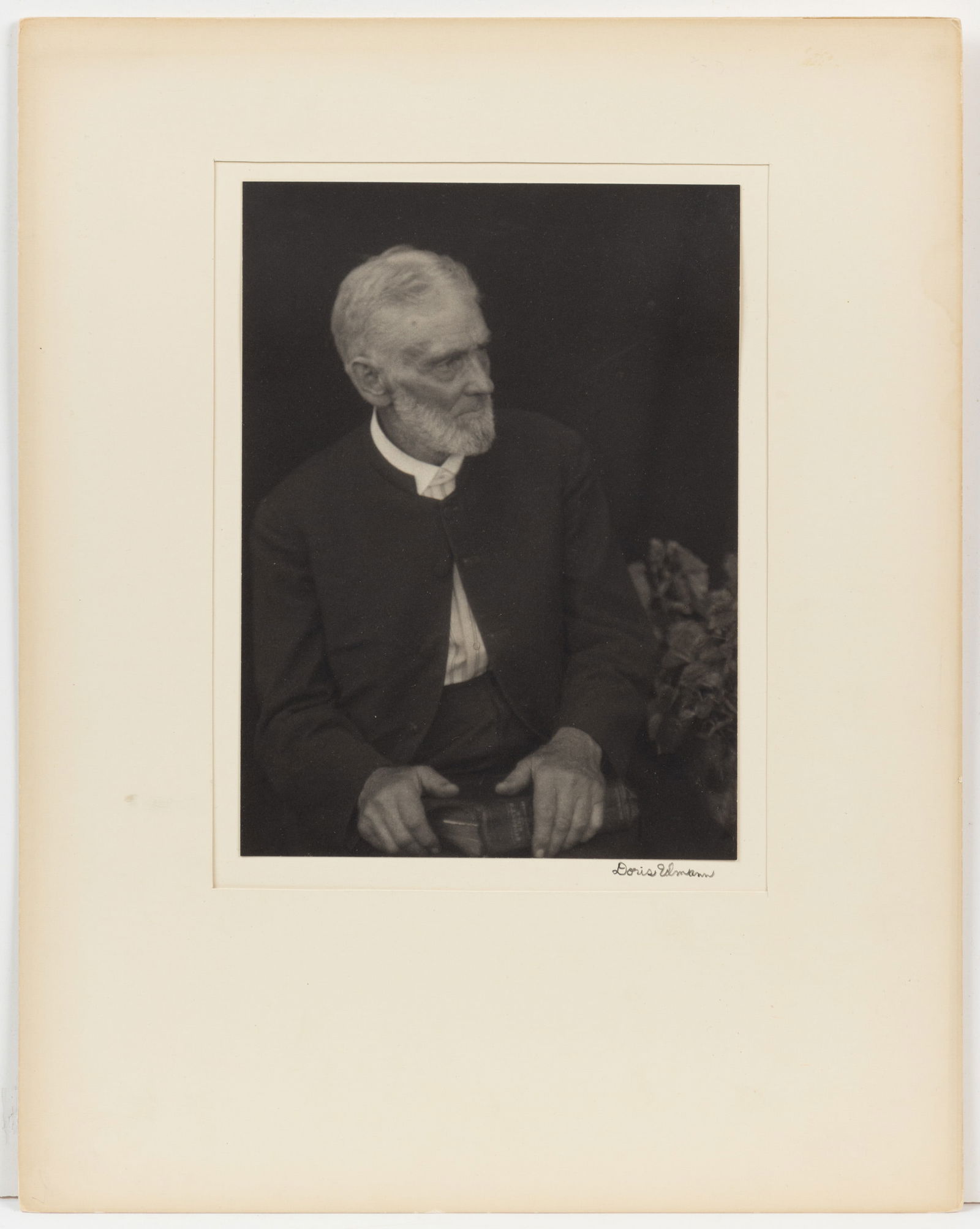 DORIS ULMANN (AMERICAN, 1882-1934) "MENNONITE MAN" PHOTOGRAPHIC PORTRAIT: DORIS ULMANN (AMERICAN, 1882-1934) "MENNONITE MAN" PHOTOGRAPHIC PORTRAIT, platinum print depicting an older bearded gentleman wearing a black collarless jacket and holding a bible,