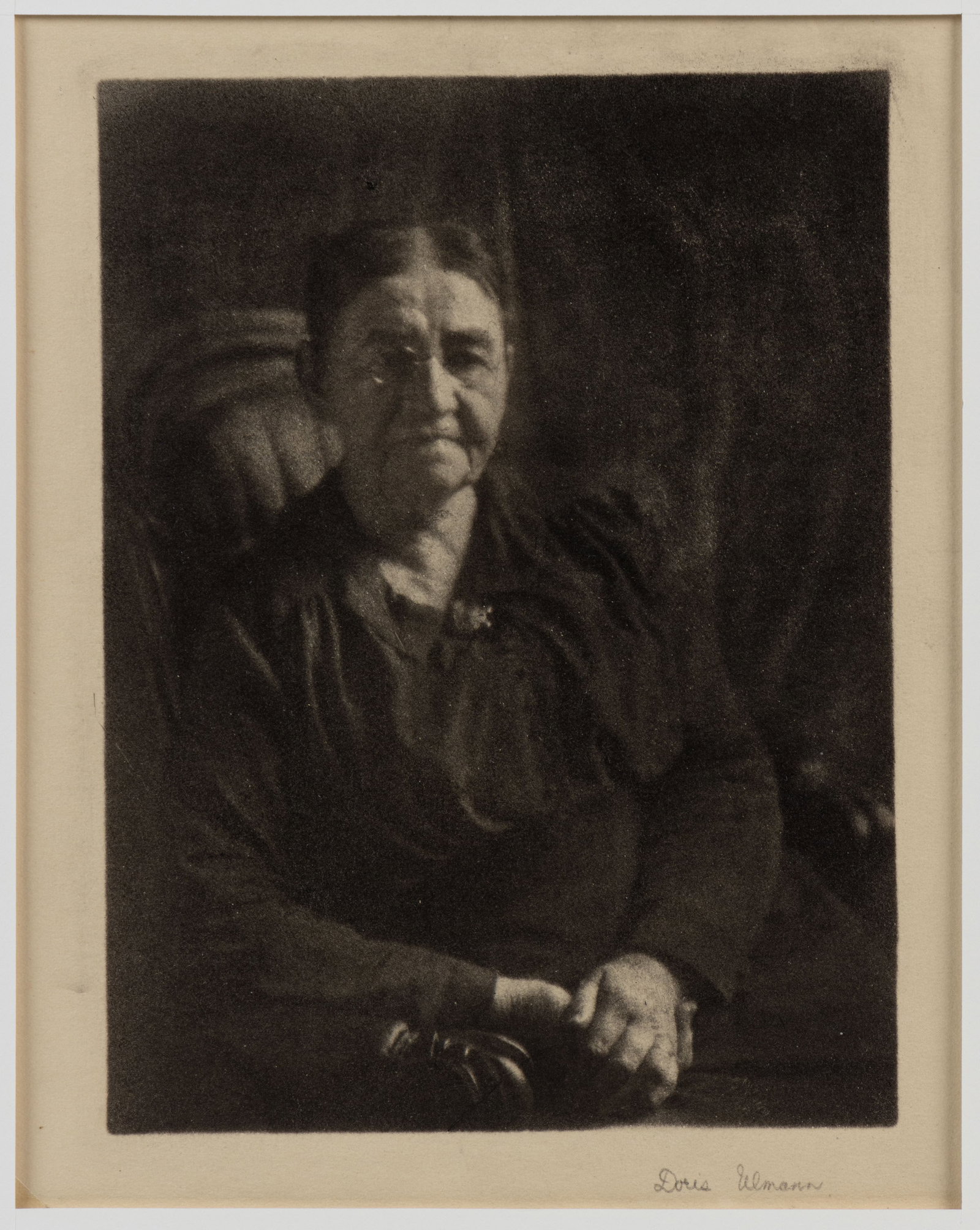 DORIS ULMANN (AMERICAN, 1882-1934) THE KNITTER / QUILTER PHOTOGRAPHIC PORTRAIT: DORIS ULMANN (AMERICAN, 1882-1934) THE KNITTER / QUILTER PENNSYLVANIA PHOTOGRAPHIC PORTRAIT, oil emulsion print depicting an older woman sitting with her hands clasped on her lap, penci