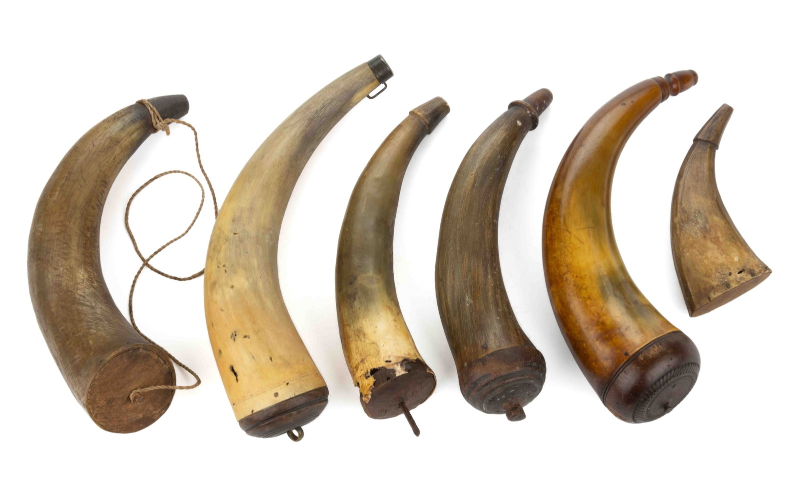 ASSORTED AMERICAN POWDER HORNS, LOT OF SIX: ASSORTED AMERICAN POWDER HORNS, LOT OF SIX, domed and flat caps, including a Lancaster, Pennsylvania example with carved rope ring to the cap, and a Virginia example with ringed cap. First half 19th c
