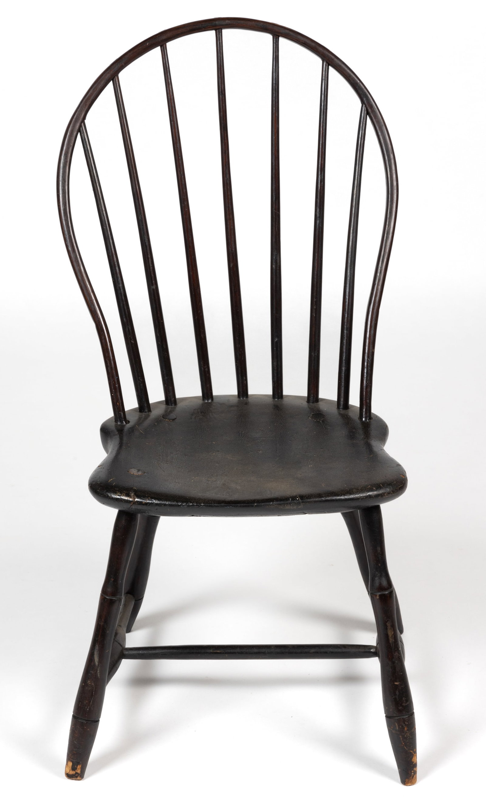 AMERICAN, POSSIBLY VIRGINIA BOW-BACK WINDSOR SIDE CHAIR: AMERICAN, POSSIBLY VIRGINIA BOW-BACK WINDSOR SIDE CHAIR, the plain back set with seven plain spindles, above a shaped plank seat, raised on slayed bamboo-turned legs joined with an H-form stretcher. R