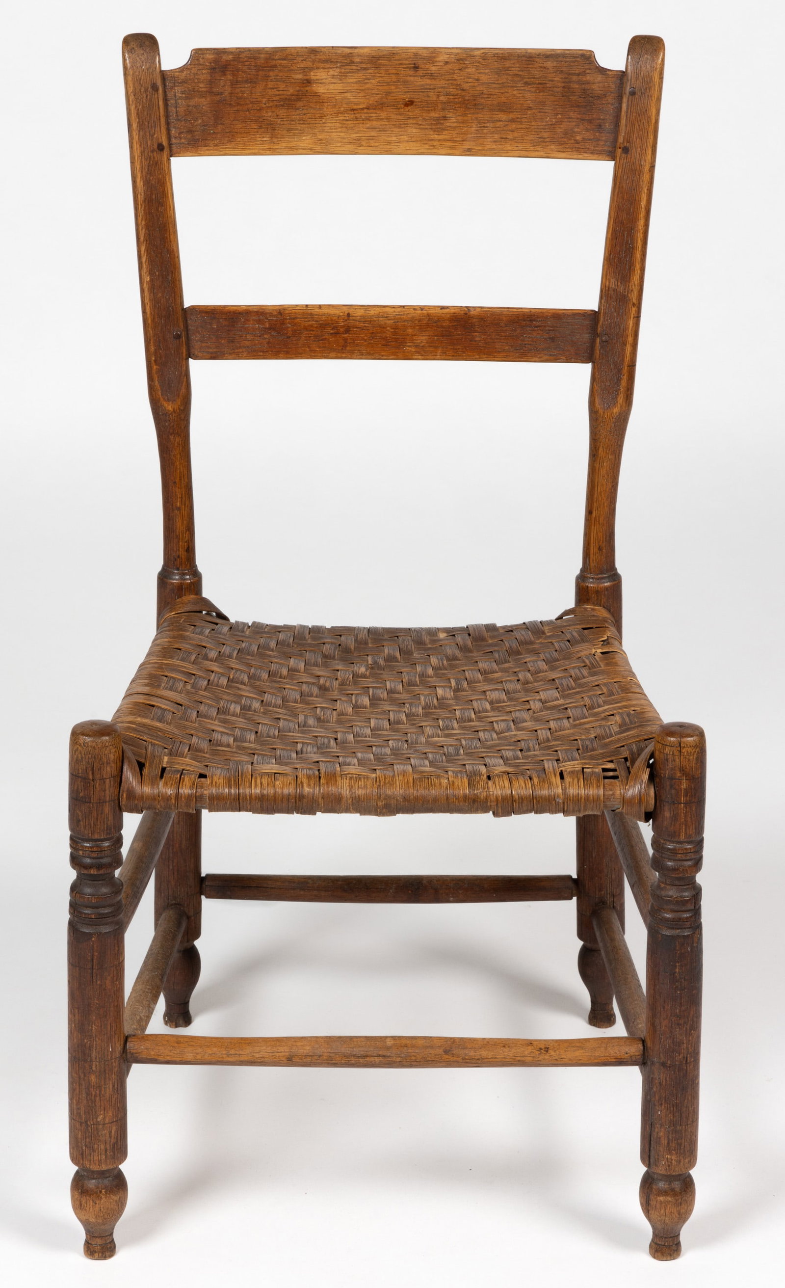 VALLEY OF VIRGINIA OAK SPLIT-BOTTOM SIDE CHAIR: VALLEY OF VIRGINIA OAK SPLIT-BOTTOM SIDE CHAIR, the two-slat back having a shaped top splat and thumb-molded posts, above its original woven white-oak splint seat, raised on boldly turned legs termina
