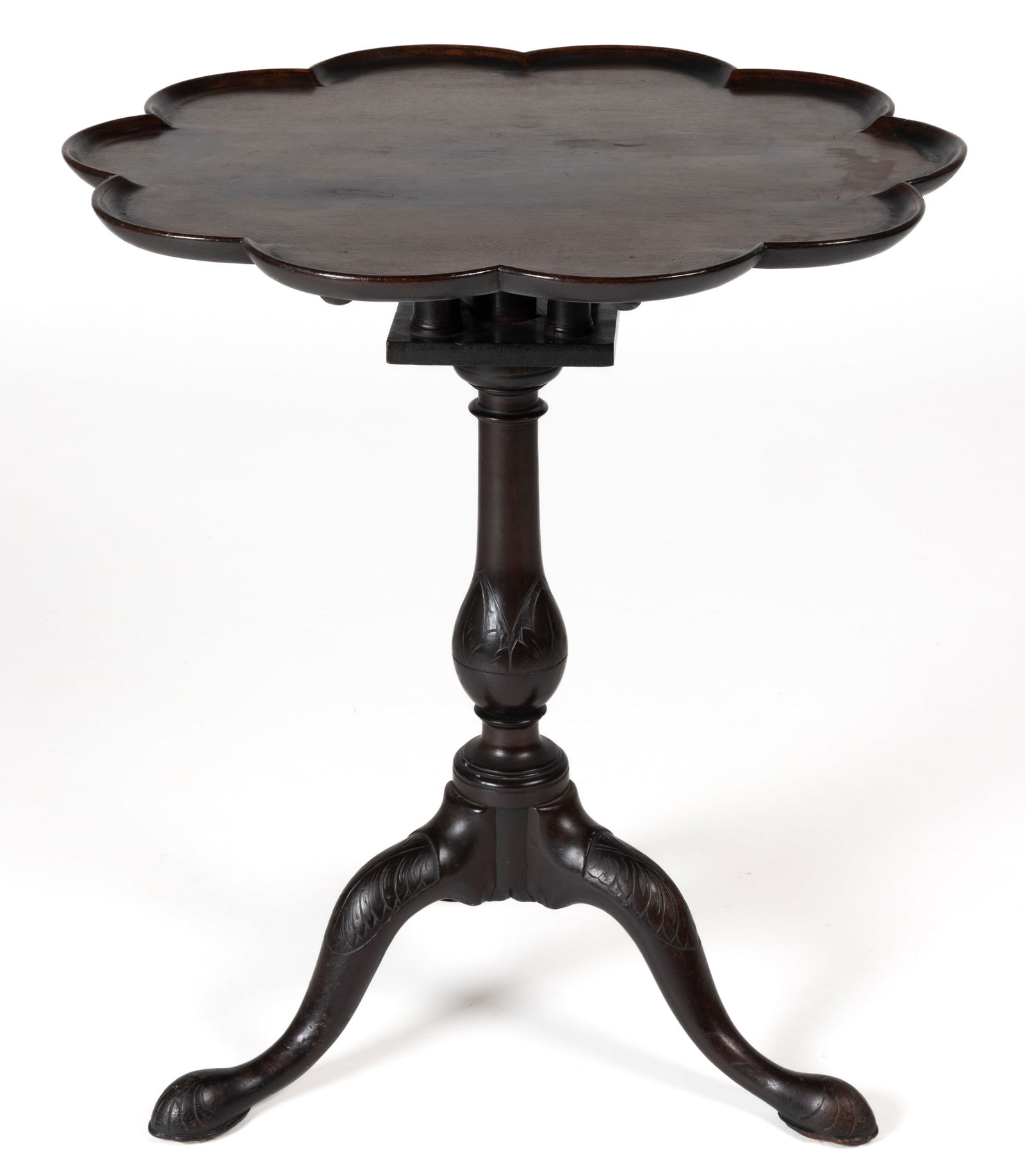 CHARLESTON, SOUTH CAROLINA, ATTRIBUTED, CHIPPENDALE CARVED MAHOGANY TILT-TOP TABLE: CHARLESTON, SOUTH CAROLINA, ATTRIBUTED, CHIPPENDALE CARVED MAHOGANY TILT-TOP TABLE, the single board top with molded pie-crust edge over a turned bird cage above a turned and carved standard 