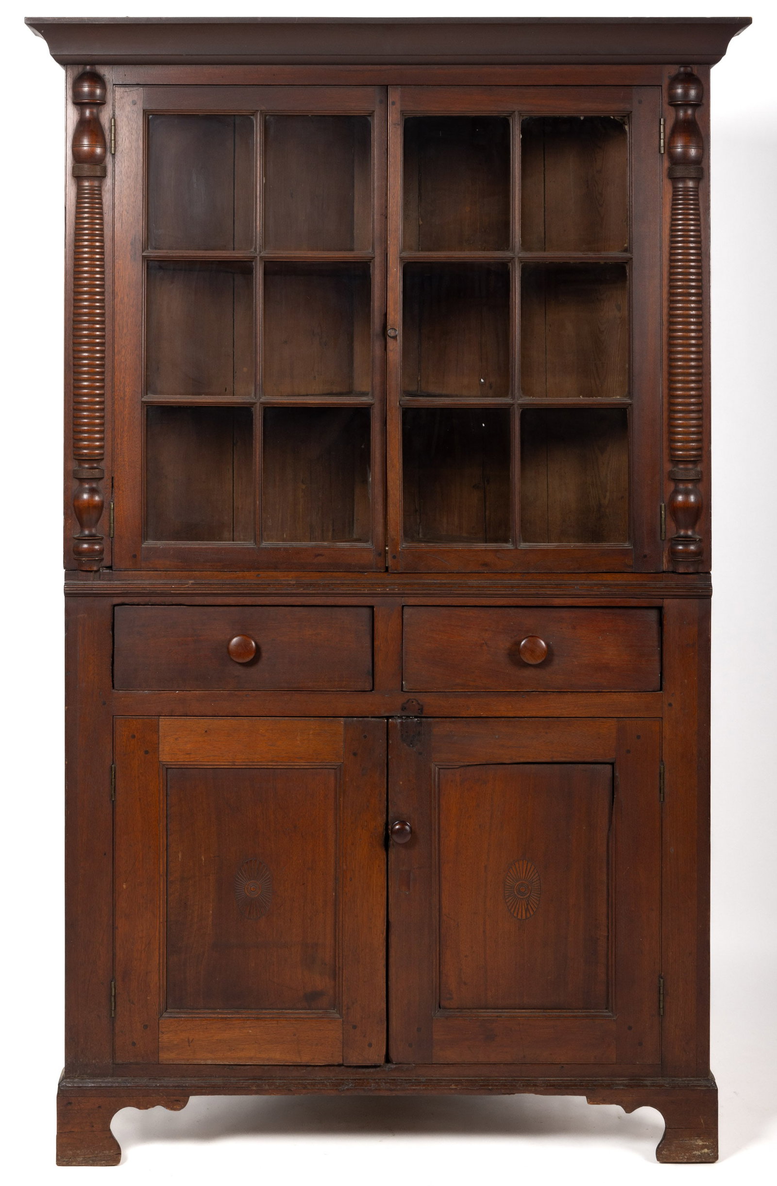 PENNSYLVANIA LATE FEDERAL WALNUT CORNER CUPBOARD: PENNSYLVANIA LATE FEDERAL WALNUT CORNER CUPBOARD, two-piece construction (originally one piece), the upper case with applied cove-molded cornice over two six-light doors concealing two fixed shelves f