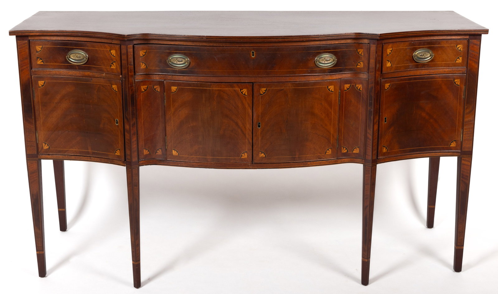 AMERICAN FEDERAL INLAID MAHOGANY SIDEBOARD: AMERICAN FEDERAL INLAID MAHOGANY SIDEBOARD, the diminutive six-leg form with exaggerated serpentine profile, featuring three drawers above hinged cabinet doors, flanked by solid ends, the whole raised