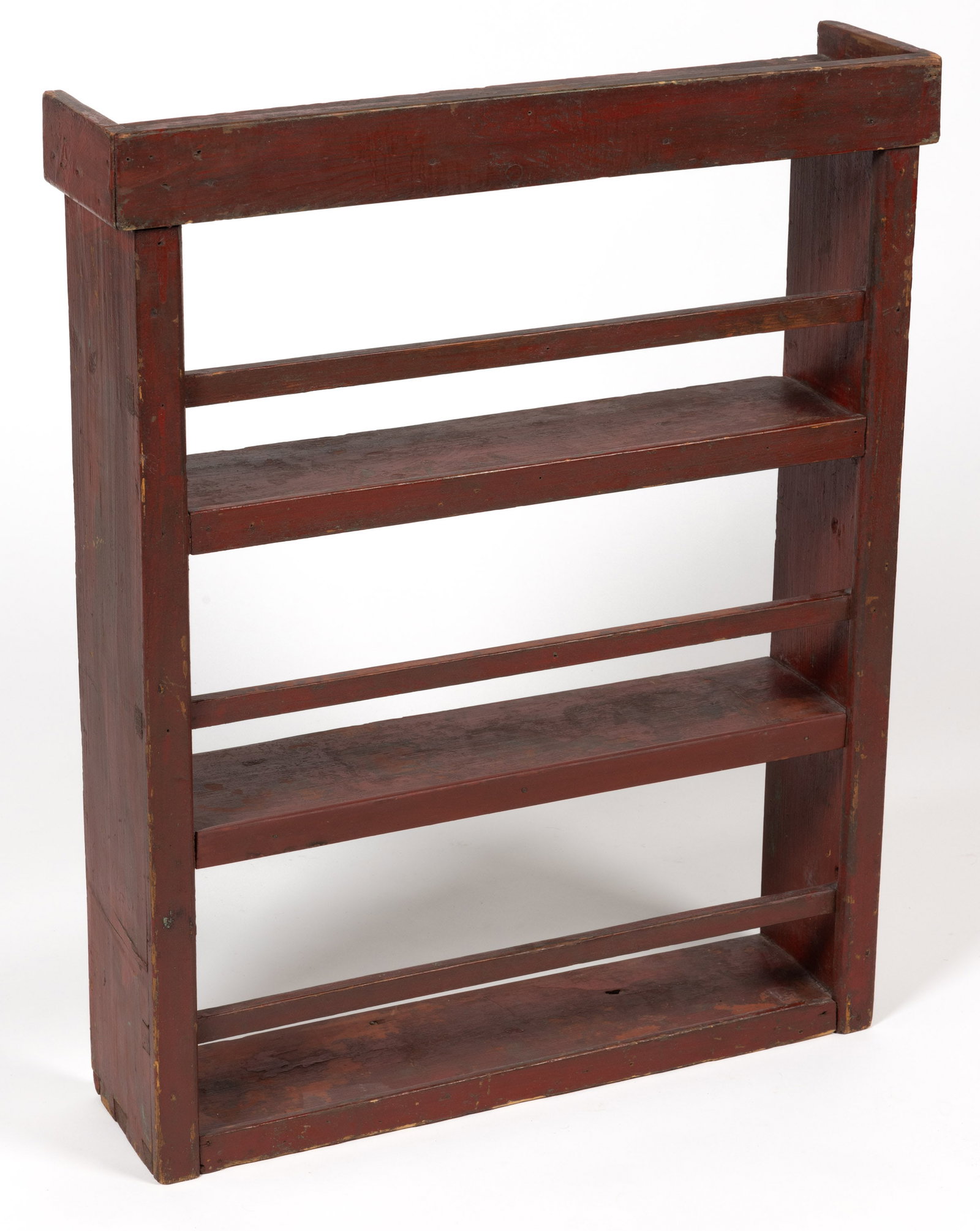 NEW ENGLAND PAINTED PINE HANGING SHELF: NEW ENGLAND PAINTED PINE HANGING SHELF, dovetailed construction, the applied plain cornice above three shelves, the two center shelves are set into the sides on sliding dovetails, the plate rails