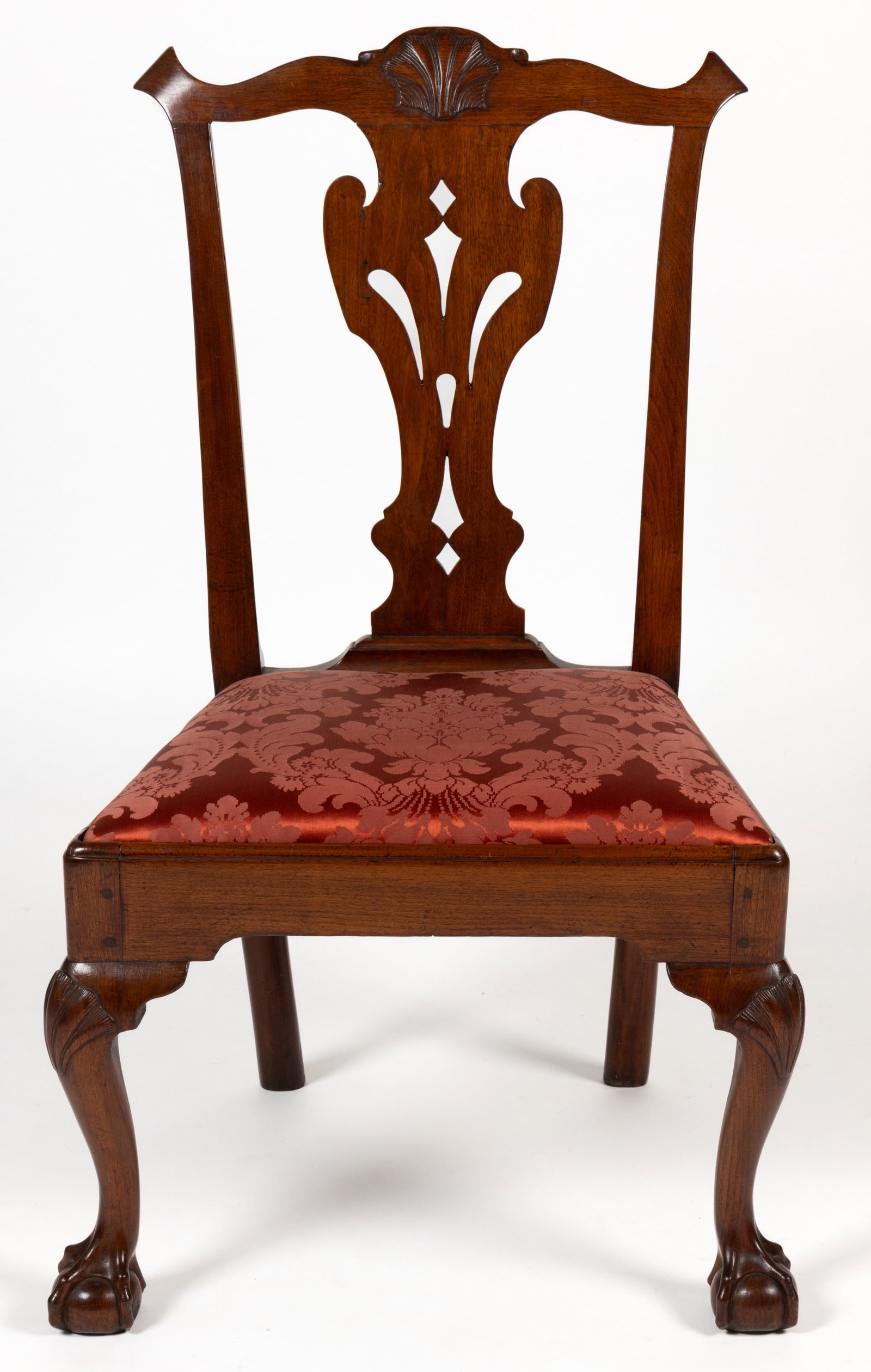 AMERICAN OR BRITISH CHIPPENDALE MAHOGANY SIDE CHAIR:  AMERICAN OR BRITISH CHIPPENDALE MAHOGANY SIDE CHAIR, featuring a serpentine crest rail with pronounced ears and a shell carving to the center above a pierced vasiform splat over a trapezoidal se