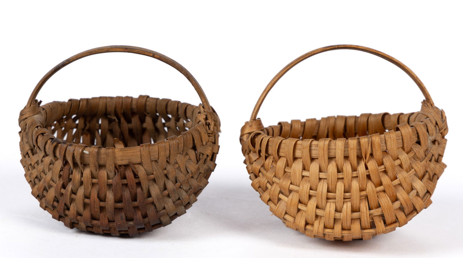 SOUTHERN APPALACHIAN RIB-TYPE WOVEN-SPLINT MINIATURE BASKETS, LOT OF TWO: SOUTHERN APPALACHIAN RIB-TYPE WOVEN-SPLINT MINIATURE BASKETS, LOT OF TWO, white oak, both featuring double X-wrapping at the handle and rim hoop junction, hoops joined together with thread as opposed