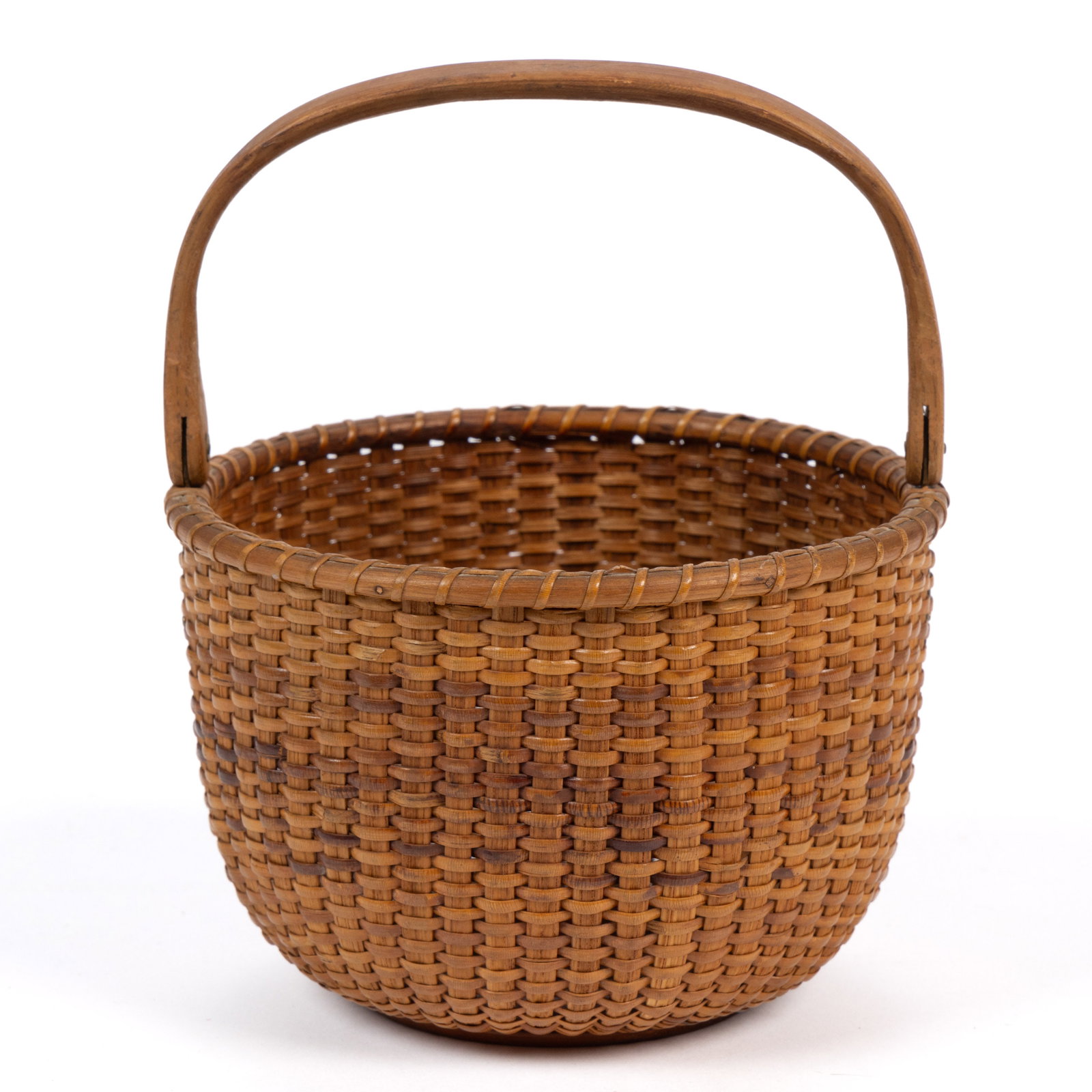 CAPTAIN THOMAS S. JAMES (1811-1885), NANTUCKET, MASSACHUSETTS LIGHTSHIP BASKET: CAPTAIN THOMAS S. JAMES (1811-1885), NANTUCKET, MASSACHUSETTS LIGHTSHIP BASKET, stave-type deep circular form with single-wrapped rim and high arched swing handle having shaped lollipop 