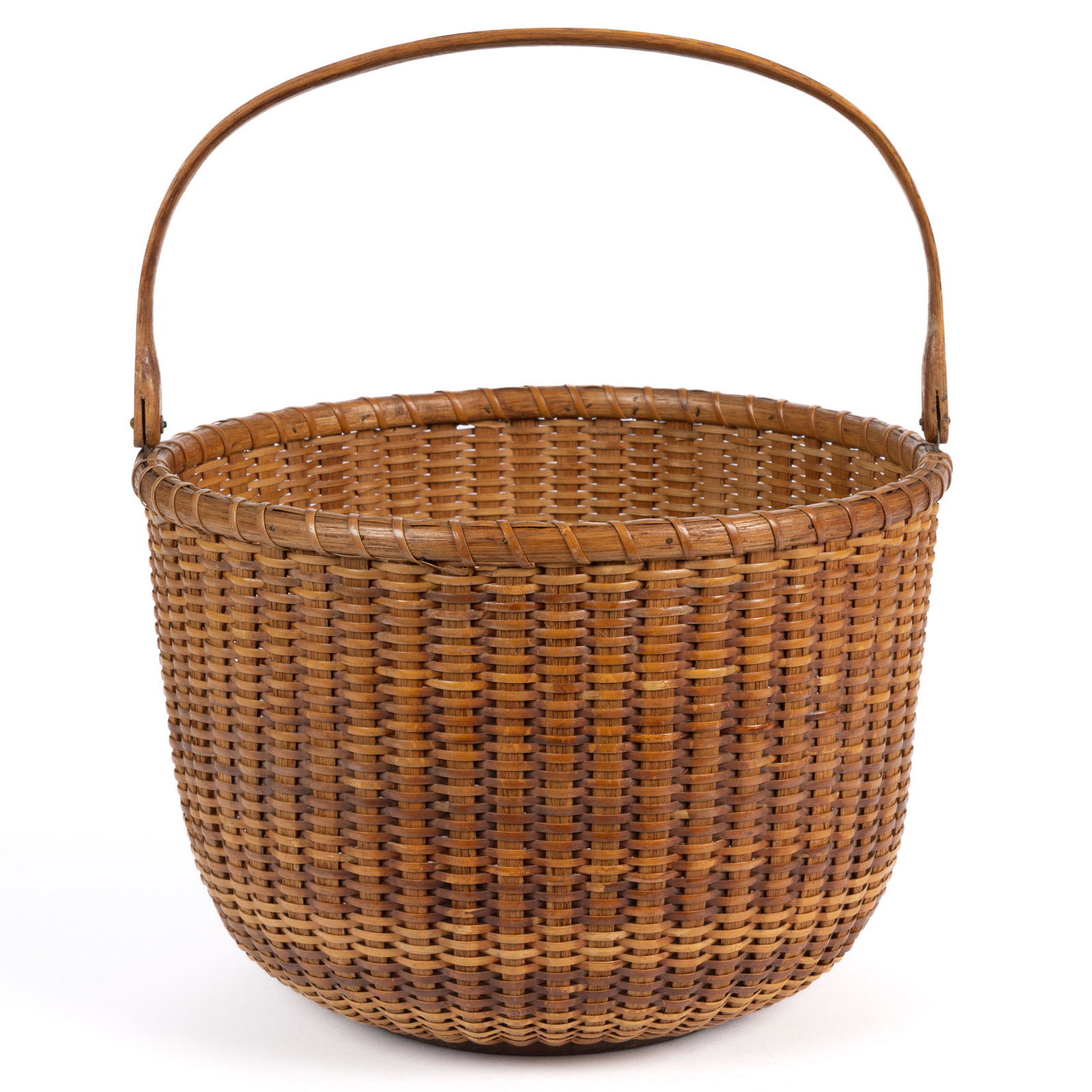 FERDINAND SYLVARO (1868-1952) NANTUCKET, MASSACHUSETTS LIGHTSHIP BASKET: FERDINAND SYLVARO (1868-1952) NANTUCKET, MASSACHUSETTS LIGHTSHIP BASKET, stave-type deep circular form with single wrapped rim and high arched swing handle having shaped lollipop termin