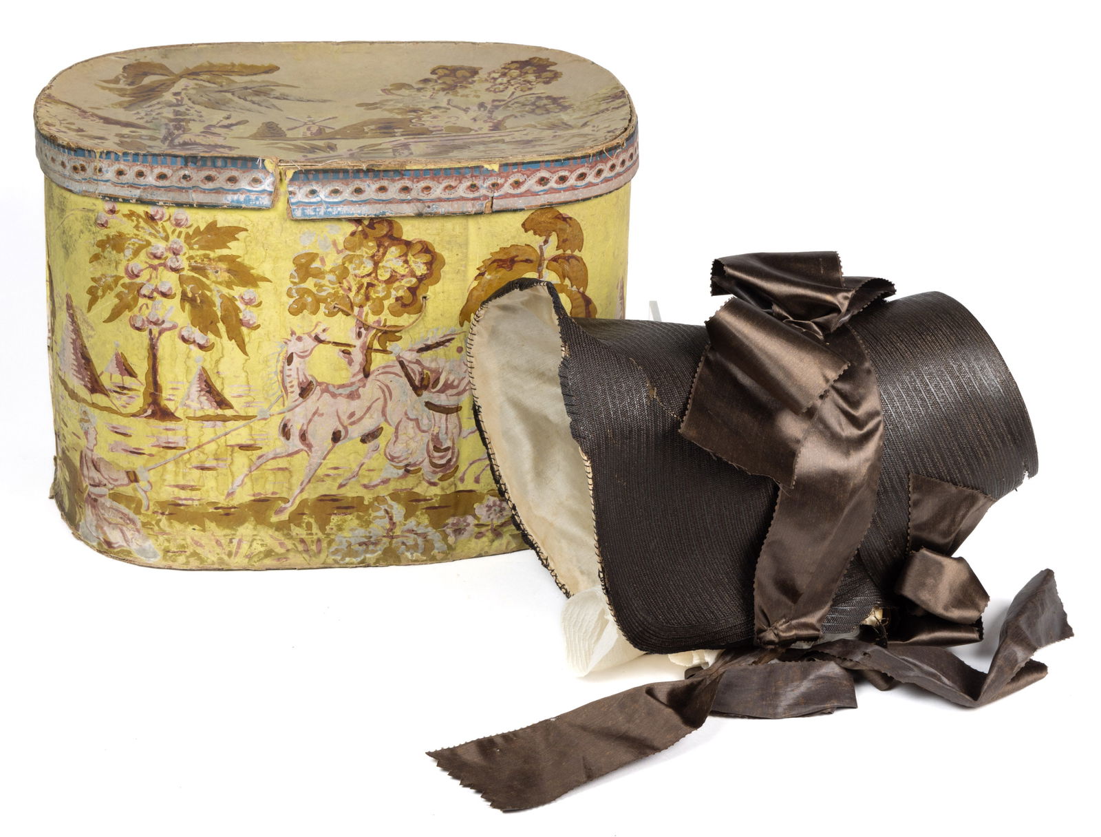 NEW YORK WALLPAPER-COVERED BAND / HAT BOX WITH BONNET: NEW YORK WALLPAPER-COVERED BAND / HAT BOX WITH BONNET, oval pasteboard form, covered in a yellow-ground paper printed with romantic views of horses and handlers within a landscape, a resting sold