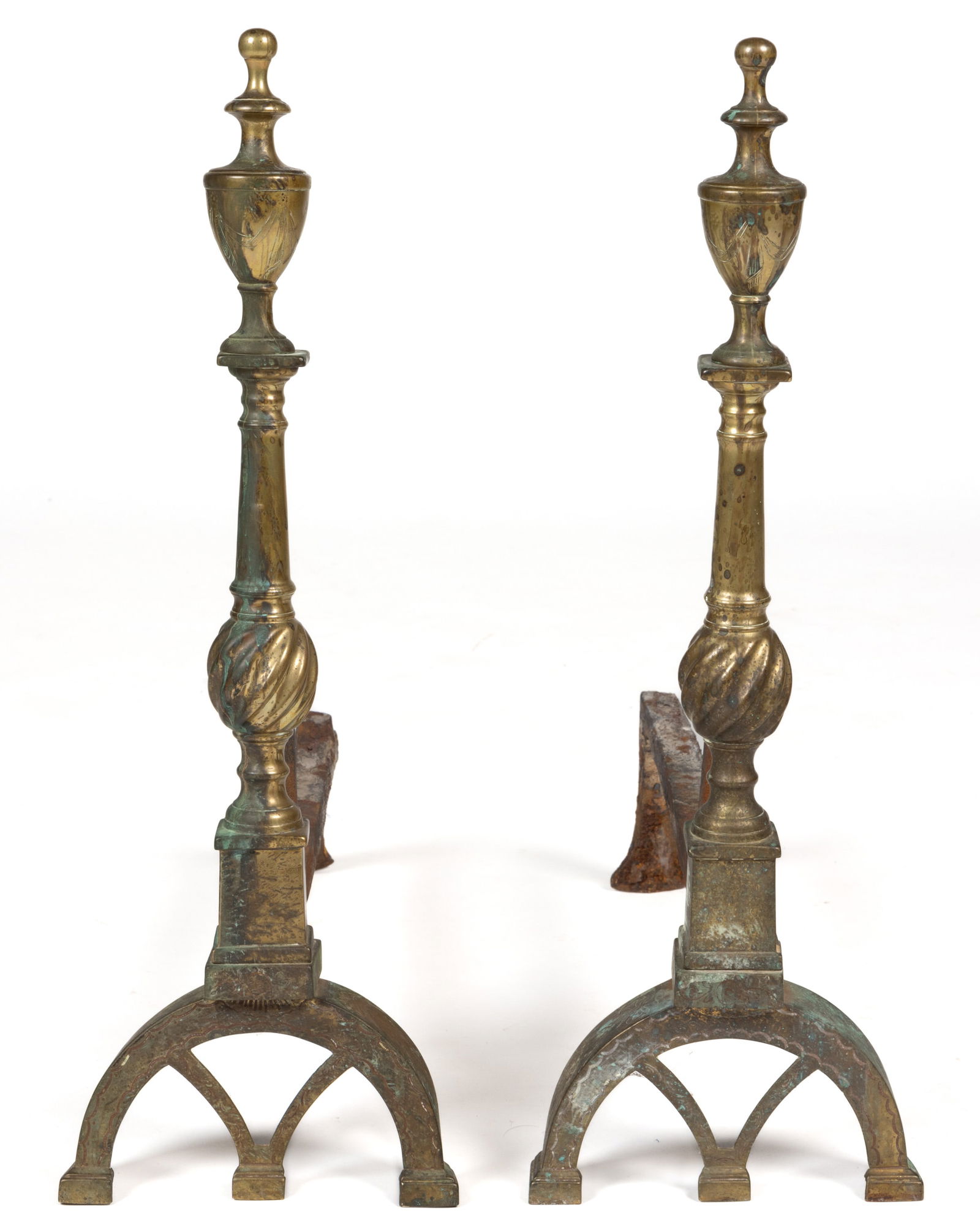 CHARLESTON, SOUTH CAROLINA, ASSOCIATED NEOCLASSICAL PAIR OF BRASS ANDIRONS: CHARLESTON, SOUTH CAROLINA, ASSOCIATED NEOCLASSICAL PAIR OF BRASS ANDIRONS, each urn-form finial features swag and punch engraving, resting on a tapered column, lower swirled ball, and plinth having f