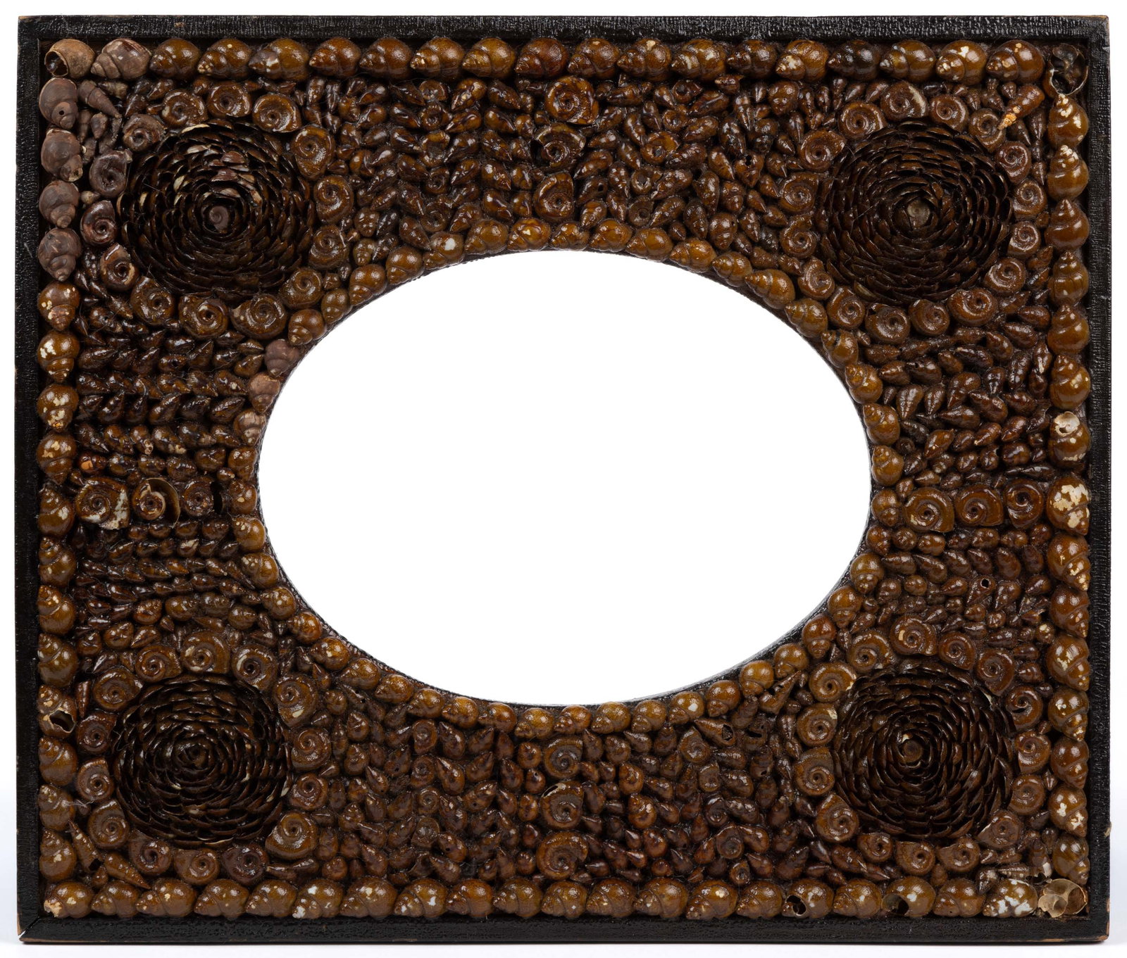 SIGNED INDIANA FOLK ART SHELLWORK PICTURE FRAME: SIGNED INDIANA FOLK ART SHELLWORK PICTURE FRAME, white pine substrate with applied poplar edging, the face set with a variety of seashells in a symmetrical arrangement, having an oval opening, verso f