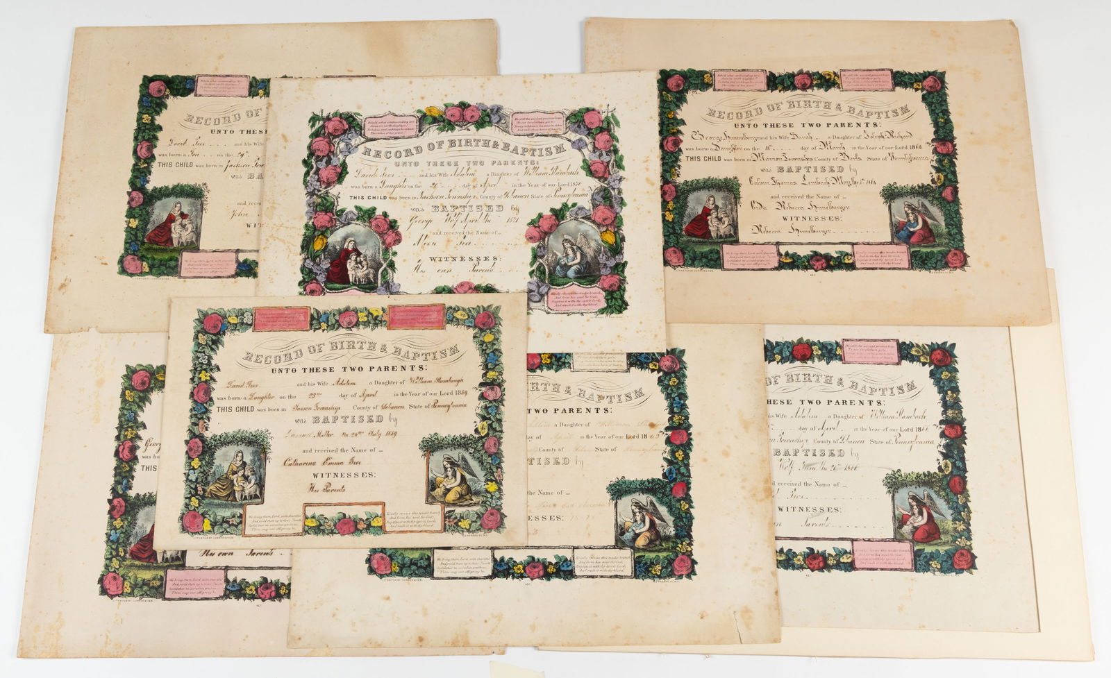 PENNSYLVANIA FOLK ART PRINTED BIRTH AND BAPTISMAL CERTIFICATES / FRAKTURS, LOT OF SEVEN: PENNSYLVANIA FOLK ART PRINTED BIRTH AND BAPTISMAL CERTIFICATES / FRAKTURS, LOT OF SEVEN, block-printed and hand-colored with watercolor, all printed by Currier and Ives in New York City, NY filled out