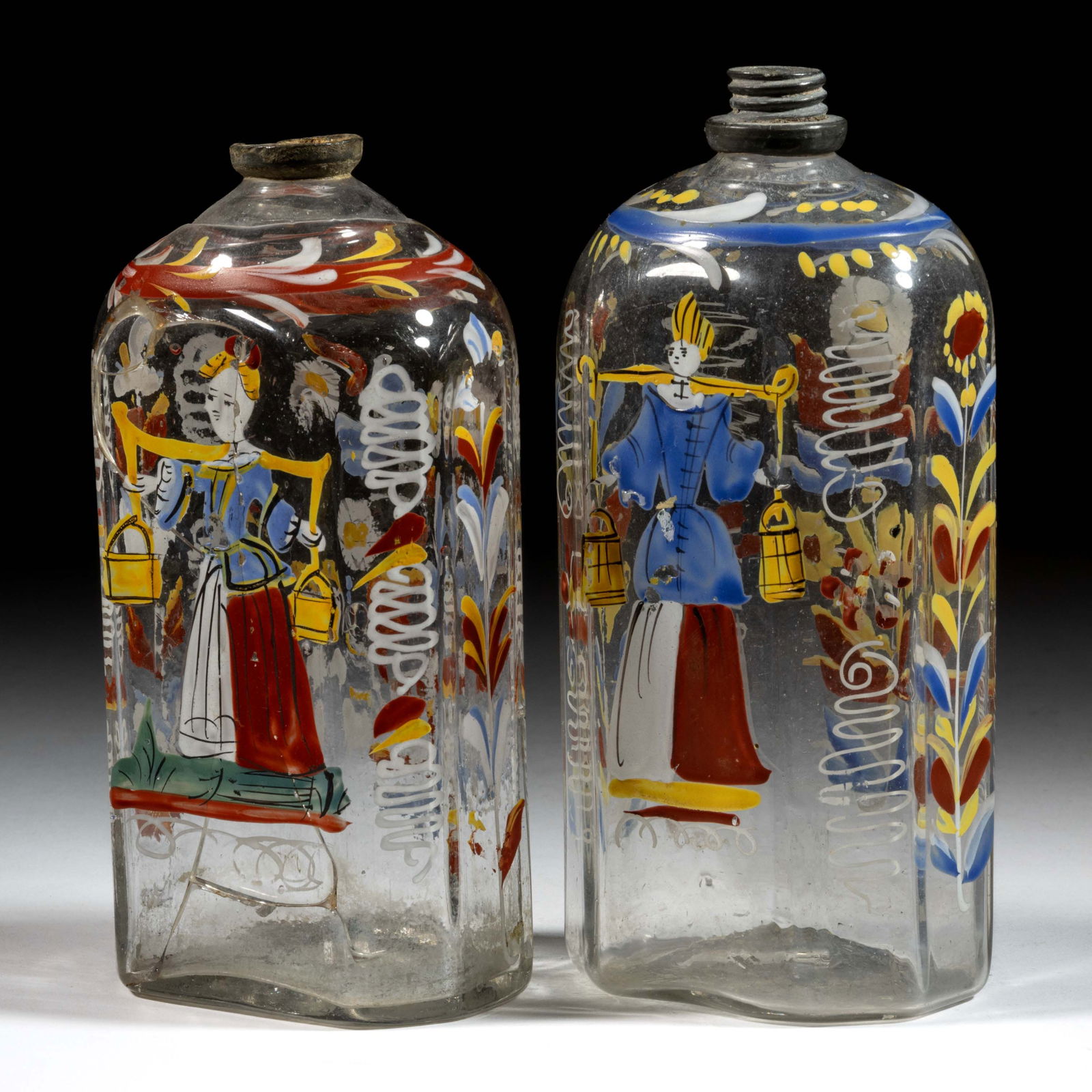 HALF-POST BLOWN AND DECORATED "STIEGEL-TYPE" BOTTLES / FLASKS, LOT OF TWO: HALF-POST BLOWN AND DECORATED "STIEGEL-TYPE" BOTTLES / FLASKS, LOT OF TWO, colorless glass, half-post method, typical flattened octagonal form with beveled corners, hand-painted polychrome enamel deco