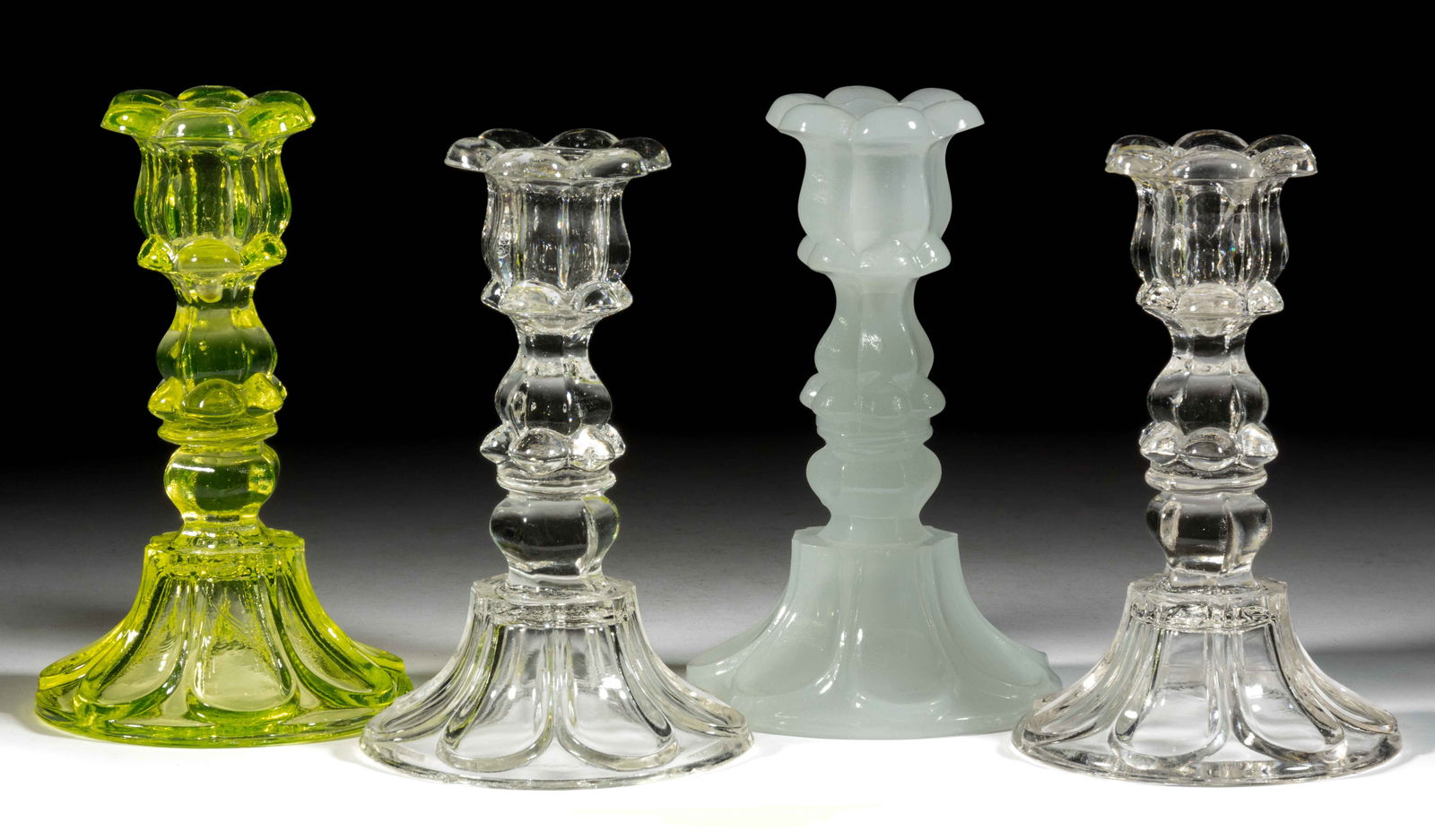 PRESSED PETAL AND LOOP CANDLESTICKS, LOT OF FOUR (1 of 1)