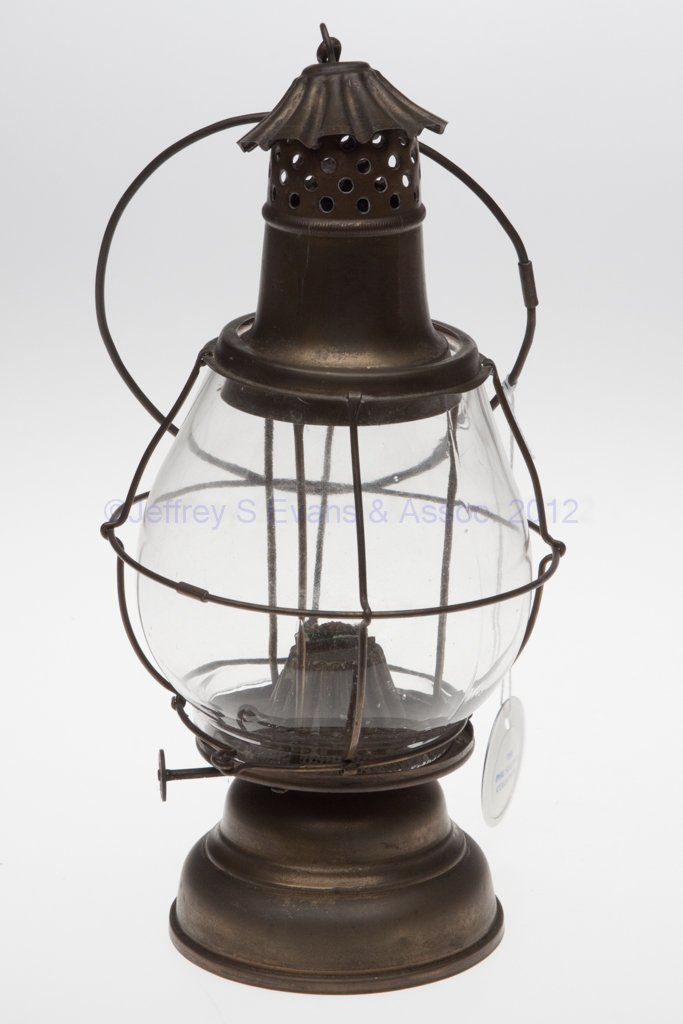 HOLMES, BOOTH & HAYDENS BRASS LANTERN: HOLMES, BOOTH & HAYDENS BRASS LANTERN, large wristlet handle, removable colorless globe embossed in a circle "HB & H" and encased in wire guard, globe support ring marked "PAT. FEB. 6TH 1877". Fitted 