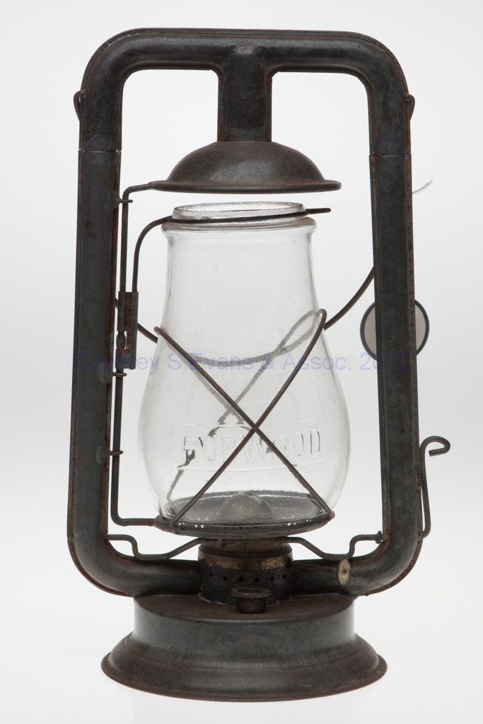 THE HURWOOD MFG. CO. "ALADDIN" SHEET IRON HOT BLAST: THE HURWOOD MFG. CO. "ALADDIN" SHEET IRON HOT BLAST TUBULAR LANTERN, bail handle, font embossed "THE HURWOOD MFG. CO." and reverse "ALADDIN", side-refill feature, colorless globe embossed "HURWOOD". F