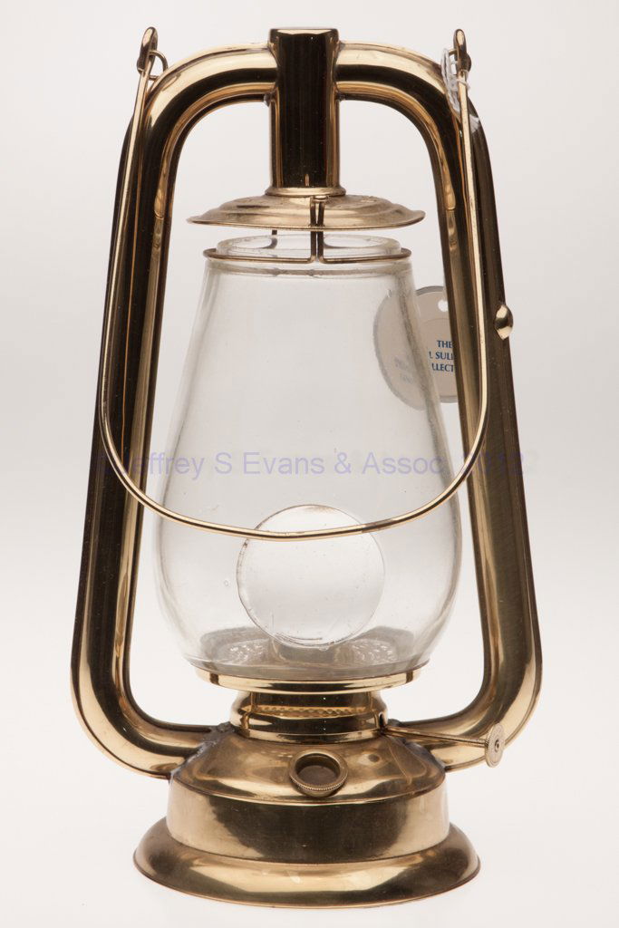 DIETZ "U. S." BRASS HOT BLAST TUBULAR LANTERN WITH: DIETZ "U. S." BRASS HOT BLAST TUBULAR LANTERN WITH BULL'S-EYE LENS, polished, bail handle, cap marked "DIETZ US. BRASS TUBULAR", colorless globe, side-refill feature, underside of base with patent inf