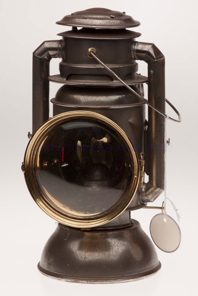 C. T. HAM MANUFACTURING CO. "NO. 18" SHEET IRON COL: C. T. HAM MANUFACTURING CO. "NO. 18" SHEET IRON COLD BLAST TUBULAR LANTERN, bail handle, mounting bracket, cap marked "HAM'S DRIVING LAMP NO. 18", underside of base marked with various patent informat