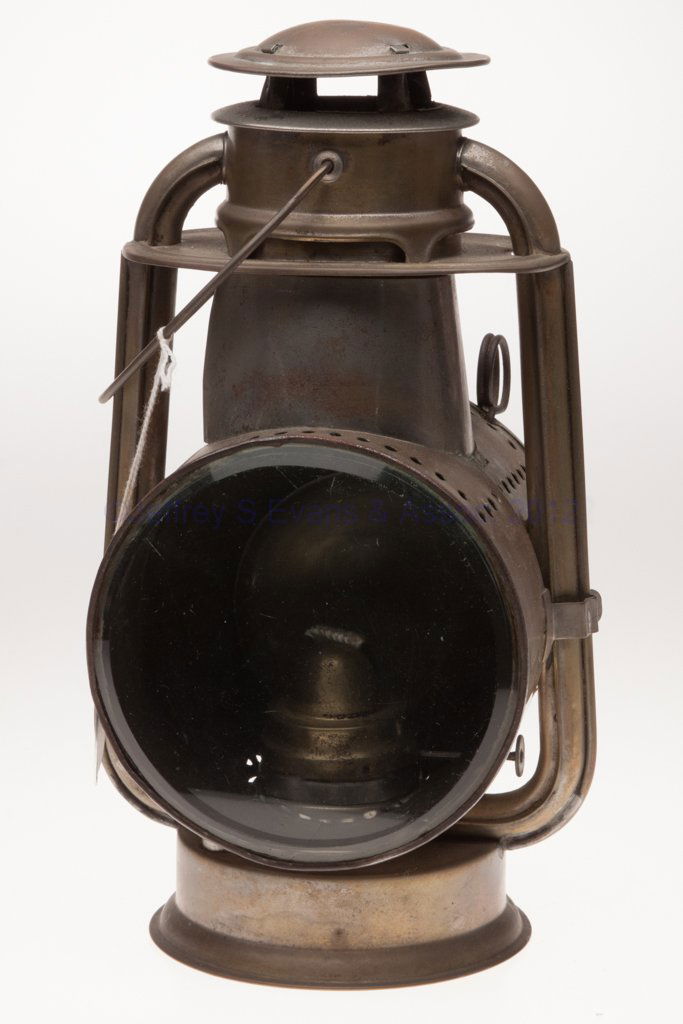 C. T. HAM MANUFACTURING CO. SHEET IRON COLD BLAST: C. T. HAM MANUFACTURING CO. SHEET IRON COLD BLAST TUBULAR LANTERN, worn brass finish, bail handle and mounting bracket, underside of font marked "PATENTED DEC. 4, 86 / FEB. 18,88 / C.T. HAM MFG CO", h
