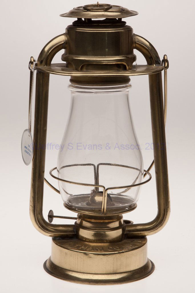 C. T. HAM MANUFACTURING CO. "NO. 00" BRASS COLD BL: C. T. HAM MANUFACTURING CO. "NO. 00" BRASS COLD BLAST TUBULAR LANTERN, polished, bail handle, font embossed "C. T. HAM CO. NO 00", side-refill feature, colorless globe. Fitted with a period brass burn