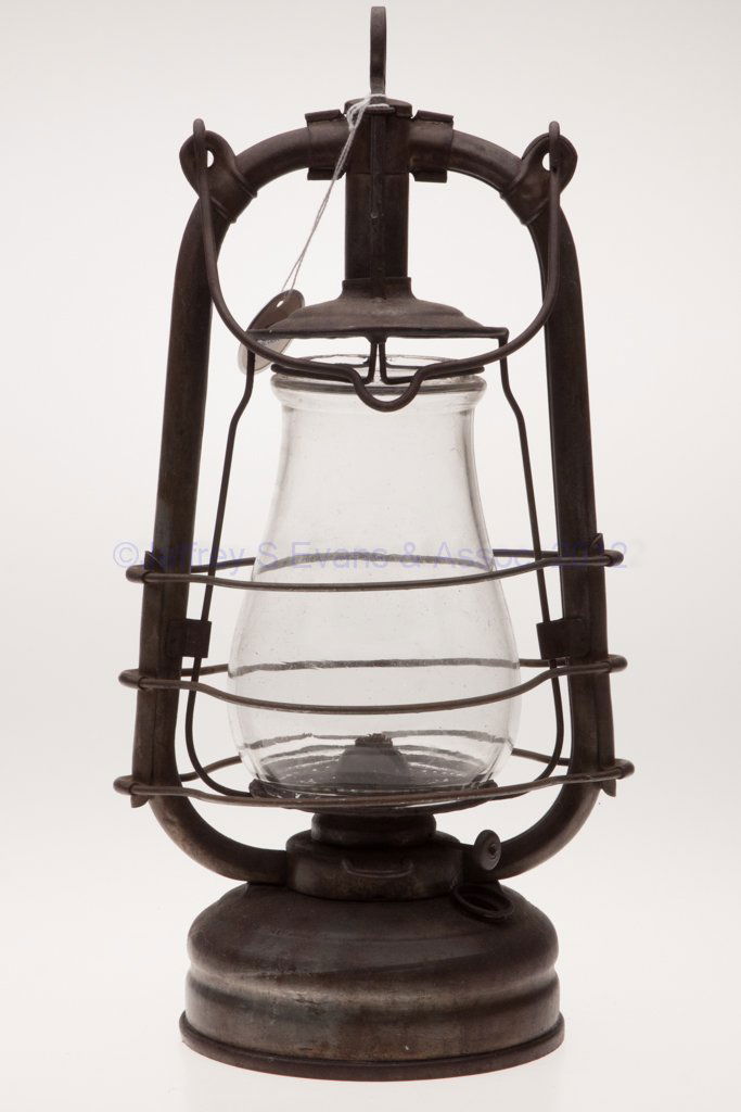 WOLF LAMP CO. SHEET IRON HOT BLAST TUBULAR LANTERN: WOLF LAMP CO. SHEET IRON HOT BLAST TUBULAR LANTERN, bail handle, underside of font with maker's label marked "WOLF SAFETY LAMP CO OF AMERICA, INC. / NEW YORK, U.S.A.", colorless globe with sliding wir