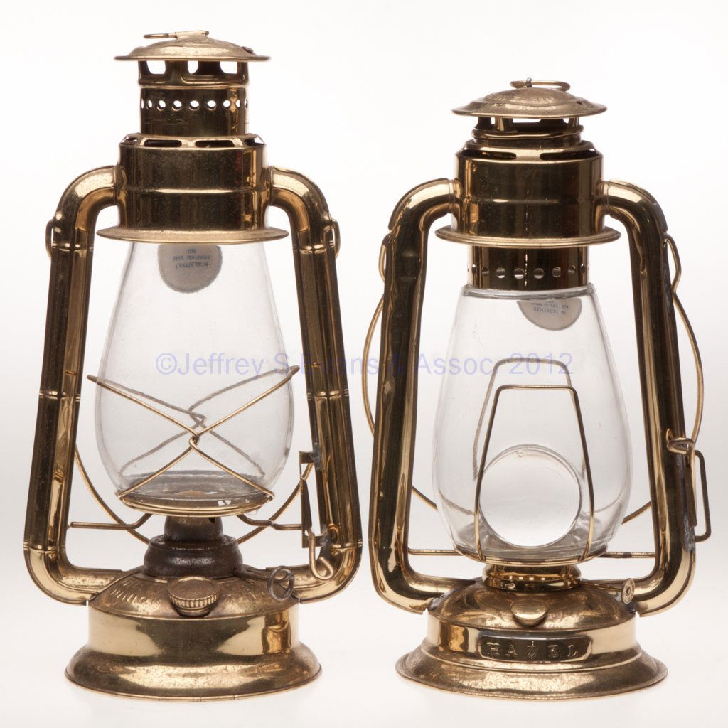 DIETZ "JUNIOR" BRASS COLD BLAST TUBULAR LANTERNS,: DIETZ "JUNIOR" BRASS COLD BLAST TUBULAR LANTERNS, LOT OF TWO, each with bail handle, ring on cap and colorless globe, comprising an example with a 2 1/4" D bulls eye lens and plate on font, marked "HA