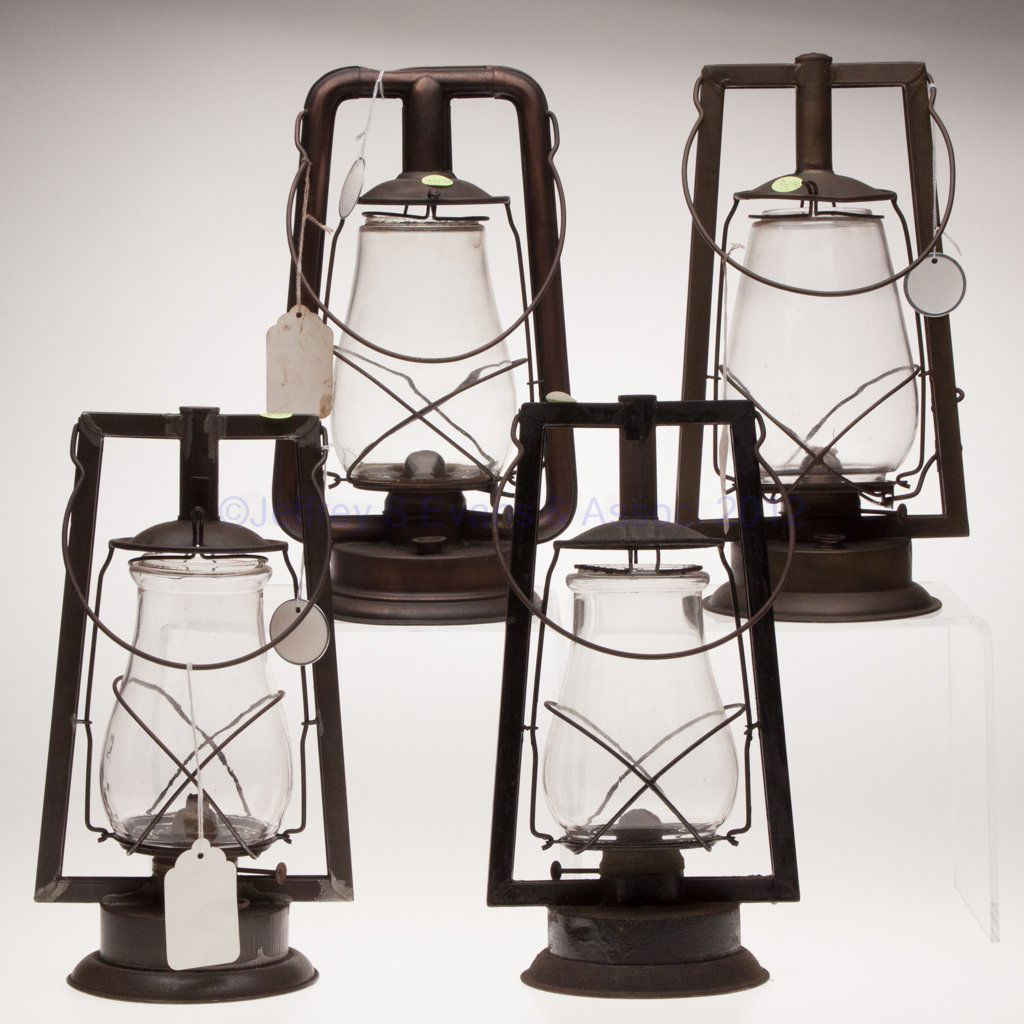 SHEET IRON HOT BLAST TUBULAR LANTERNS, LOT OF FOUR: SHEET IRON HOT BLAST TUBULAR LANTERNS, LOT OF FOUR, each with bail handle and colorless globe, comprising three Dietz examples, including "No. 0 Square Lift Tubular", a "Monarch" with copper finish, a