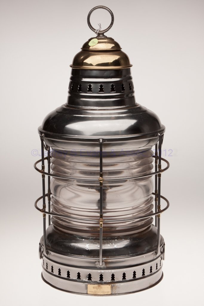 PERKINS "PERKO" SHEET IRON AND BRASS ANCHOR MARINE: PERKINS "PERKO" SHEET IRON AND BRASS ANCHOR MARINE LANTERN, polished, iron ring handle, brass maker's plate marked "PERKO / MANUFACTURERS PERKINS MARINE LAMP & HARDWARE CORP. / BROOKLYN N. Y., U.S.A."