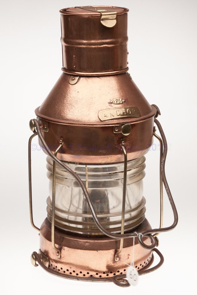 BRASS AND COPPER ANCHOR MARINE LANTERN: BRASS AND COPPER ANCHOR MARINE LANTERN, polished, iron bail handle to top and base, hinged cap and cover, cover with brass plate marked "2754" over "ANCHOR", colorless 360 degree fresnel lens with ver