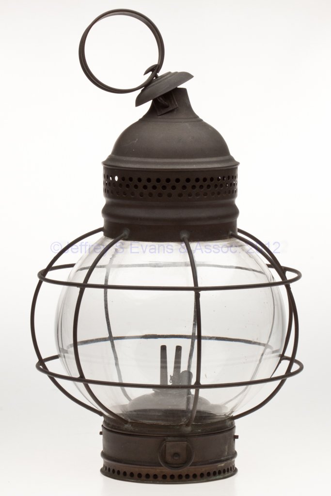 BRASS AND SHEET IRON SIGNAL MARINE LANTERN: BRASS AND SHEET IRON SIGNAL MARINE LANTERN, original patina, strap ring handle, colorless 360 degree fixed globe with wire guards, removable base with bayonet mechanism and fitted with a font and two 
