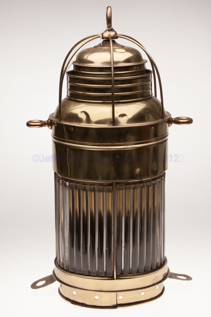 RUSSELL & WATSON BRASS ELECTRIC MARINE LIGHT: RUSSELL & WATSON BRASS ELECTRIC MARINE LIGHT, polished, ring handle, cover impressed "Manufactured by Russell & W???? / Buffalo N. Y.", colorless two-part ribbed-pattern lenses, to tie-down rings to t
