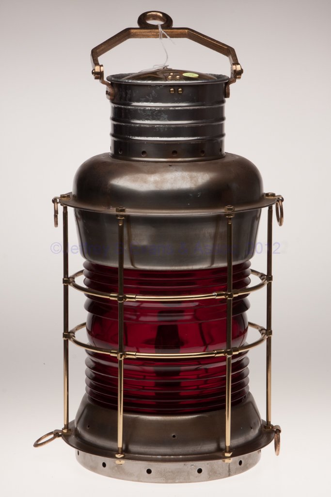 DURKEE MARINE PRODUCTS BRASS AND SHEET IRON ANCHOR: DURKEE MARINE PRODUCTS BRASS AND SHEET IRON ANCHOR MARINE LANTERN, cast bronze bail handle marked "DURKEE MARINE PRODUCTS CORP STATEN ISLAND NY", hinged cap, four tie-down rings, red/ruby 360 degree f