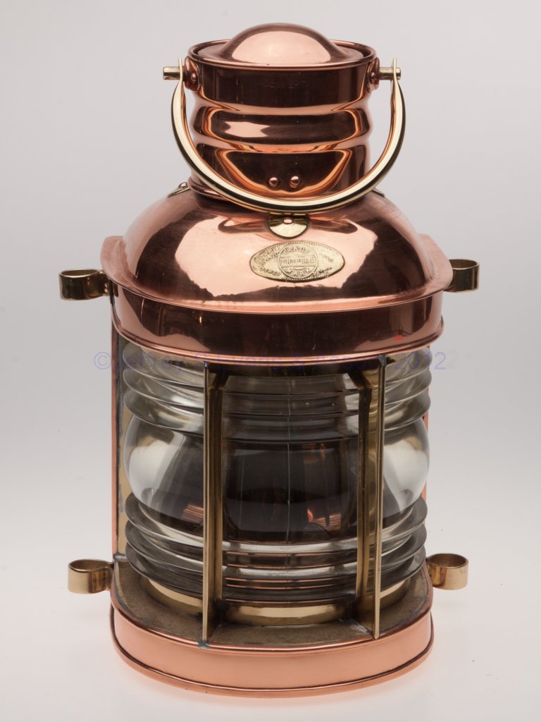 BRITISH TRIPLEX TRADE MARK BRASS AND COPPER MARINE: BRITISH TRIPLEX TRADE MARK BRASS AND COPPER MARINE LANTERN, polished, bail handle, flat back with hinged door, cover with brass maker's plate marked "LENSE PATD DEC. 20 1910 / OTHER PATS PEN", cap imp