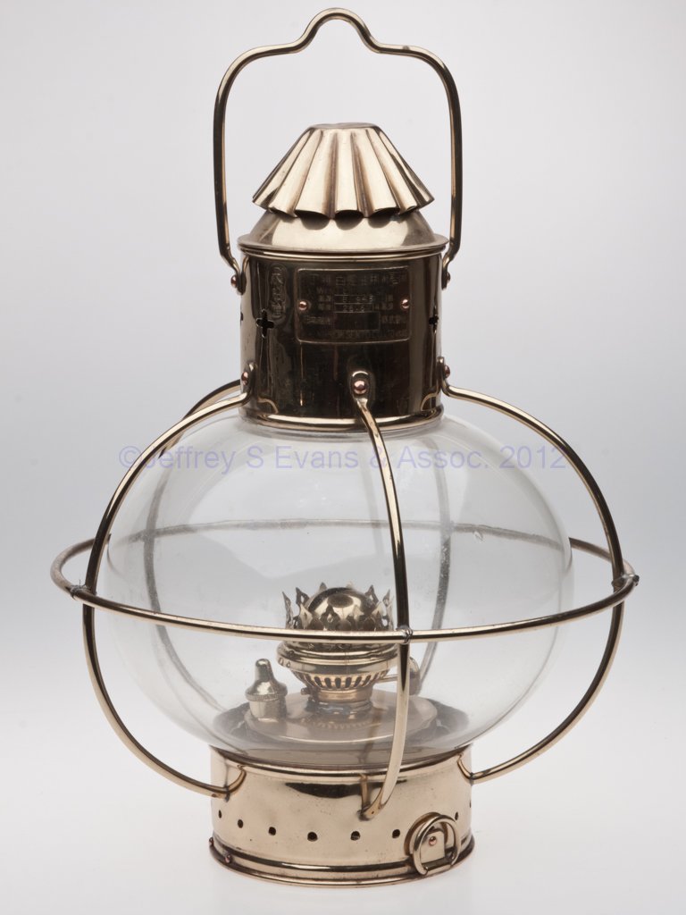 NIPPON SENTO CO. "WHITE LIGHT" BRASS SIGNAL MARINE: NIPPON SENTO CO. "WHITE LIGHT" BRASS SIGNAL MARINE LANTERN, polished, bail handle to top and ring handle to base, hinged cap, maker's plate marked with various Japanese figures and "WHITE LIGHT / B 94