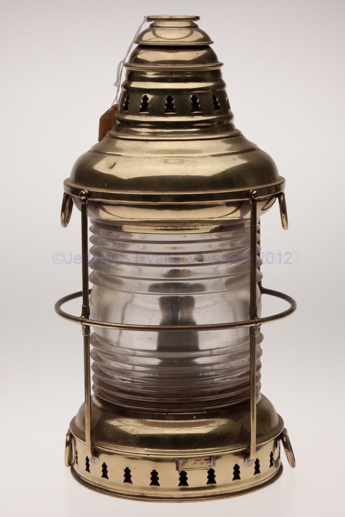 PERKINS "PERKO" BRASS ANCHOR MARINE LANTERN: PERKINS "PERKO" BRASS ANCHOR MARINE LANTERN, polished, ring handle, base with maker's plate marked "PERKO / PERKINS MARINE LAMP & HDWE CORP", top and bottom each with two tie-down rings, colorless 360