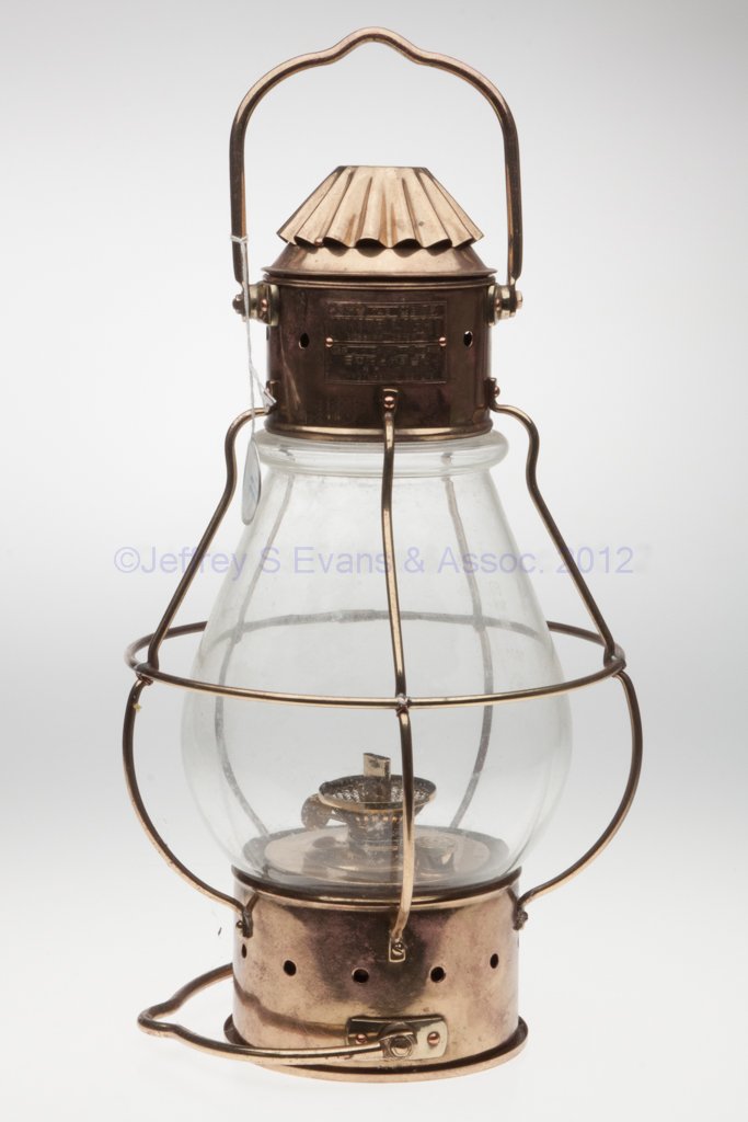 NIPPON SENTO CO. BRASS SIGNAL MARINE LIGHT: NIPPON SENTO CO. BRASS SIGNAL MARINE LIGHT, lightly polished, bail handle to top and base, hinged cap, maker's plate marked with various Japanese figures and "742 / WHITE LIGHT / 488 / 32 / 12 / NIPPO