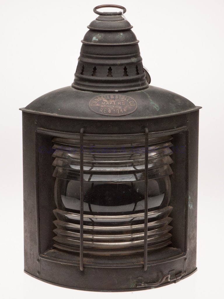 RUSSELL & STOLL CO. COPPER MARINE LIGHT: RUSSELL & STOLL CO. COPPER MARINE LIGHT, ring handle, triangular form with hinged door and other side with mounting bracket, brass maker's plate marked "RUSSELL & STOLL CO. MAKERS / NEW YORK", colorle