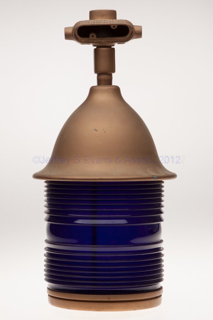 THE GAMEWELL CO. ELECTRIC CAST METAL SIGNAL LIGHT: THE GAMEWELL CO. ELECTRIC CAST METAL SIGNAL LIGHT, brass finish, base embossed with maker's mark and "THE GAMEWELL CO / PAT. 1661427 / REG US PAT OFF / NEWTON MASS.", blue 360 degree fresnel lens embo
