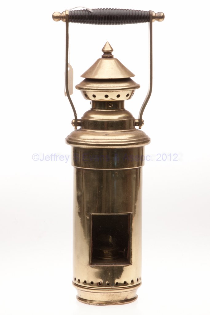 BRASS BINNACLE LANTERN: BRASS BINNACLE LANTERN, polished, bail handle, removable font, No. 1 inset collar. Fitted with an E. Miller Simplex wide-wick burner. Late 19th/early 20th century. 13 1/2" HOA, 12" H to top of cap, 3 