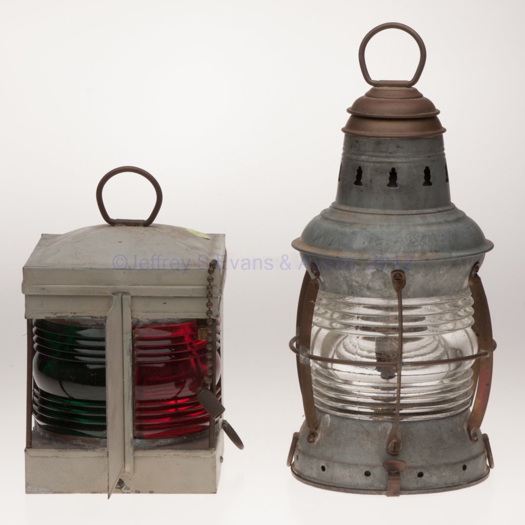 WILCOX, CRITTENDEN & CO. SHEET IRON MARINE LIGHTIN: WILCOX, CRITTENDEN & CO. SHEET IRON MARINE LIGHTING, LOT OF TWO, each with ring handle and two tie-down rings, comprising a square-form navigation electric light with gray paint, fitted with a mountin