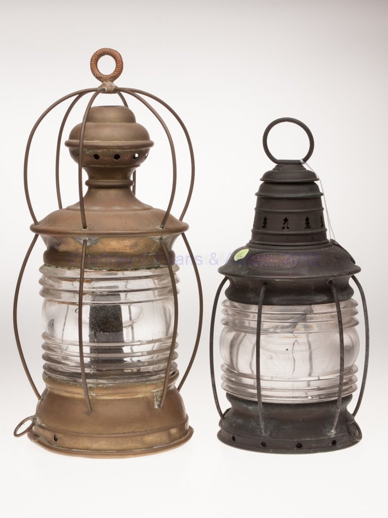 VARIOUS MANUFACTURERS COPPER AND BRASS ANCHOR MARI: VARIOUS MANUFACTURERS COPPER AND BRASS ANCHOR MARINE LANTERNS, LOT OF TWO, comprising a copper L. W. Ferdinand & Co. example and a brass Lovell example, each with two tie-down rings to base, colorless