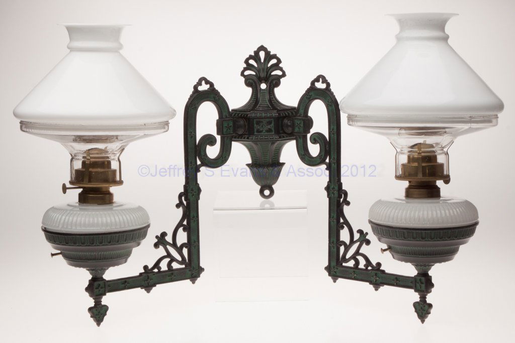 BRADLEY & HUBBARD NO. 401 CAST IRON DOUBLE-ARMED: BRADLEY & HUBBARD NO. 401 CAST IRON DOUBLE-ARMED BRACKET LAMP, near pair alabaster/clambroth fonts with rib and shell pattern, each with a No. 2 fine line collar, bracket with black and green enamel f